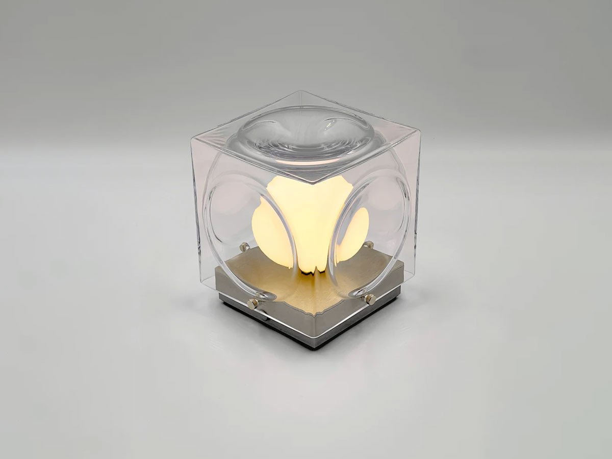 CHANT portable lamp with a glass shade and a gold base.
