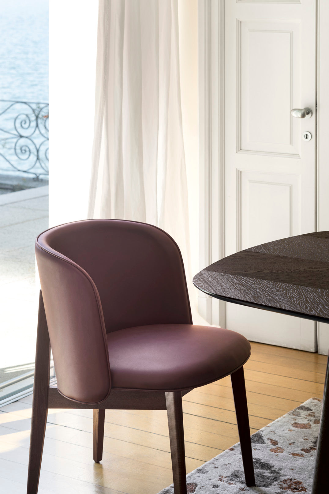 Armchair ABREY upholstered with a black wooden base