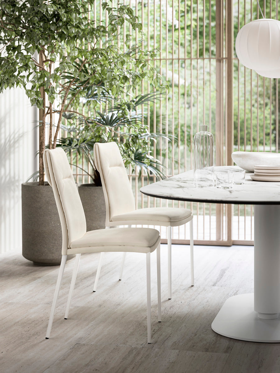 CARMEN upholstered chair with a black base