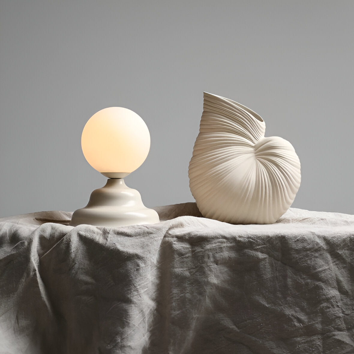 Table lamp with a glass lampshade cream wave