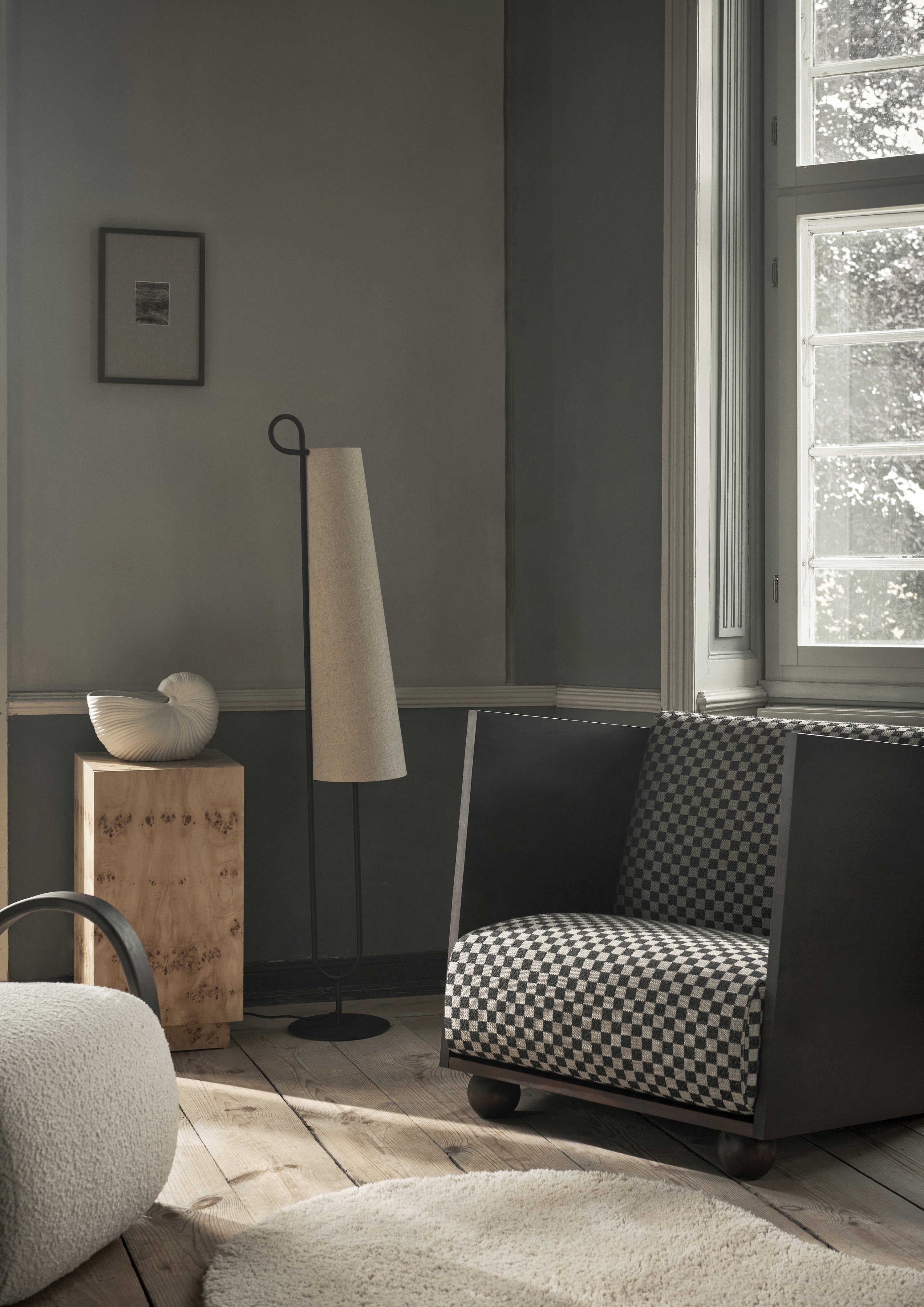 RUM armchair in sandy check with a dark brown wooden base