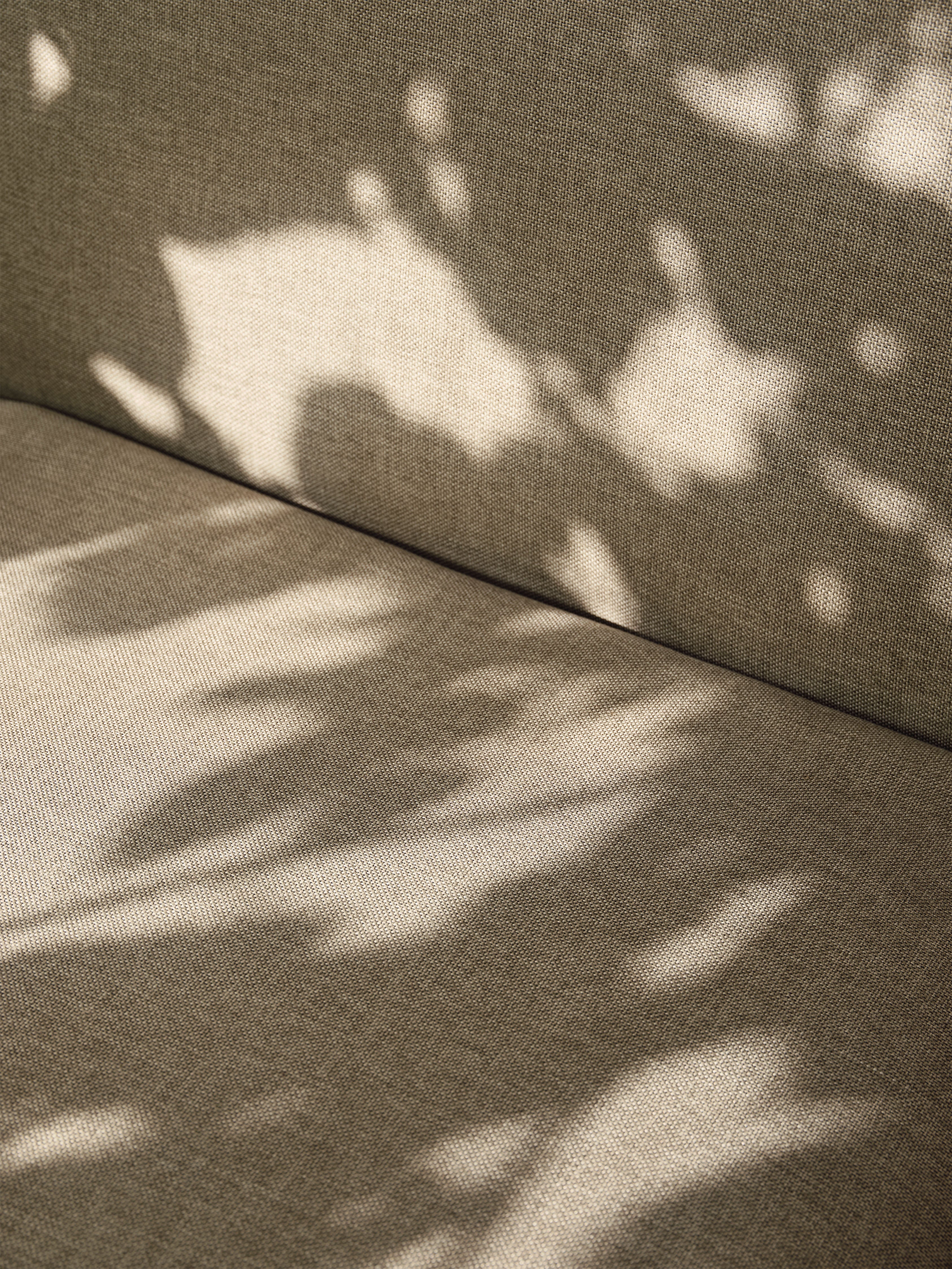 Desert beige external armchair with a black base