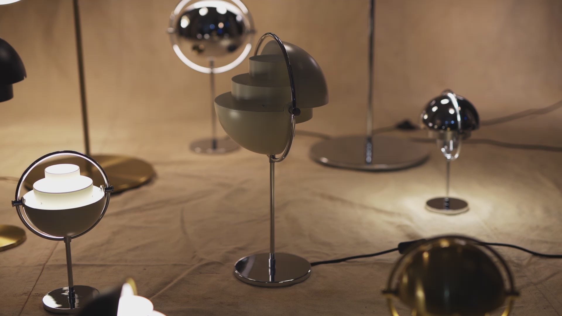MULTI-LITE table lamp in black with a chrome base