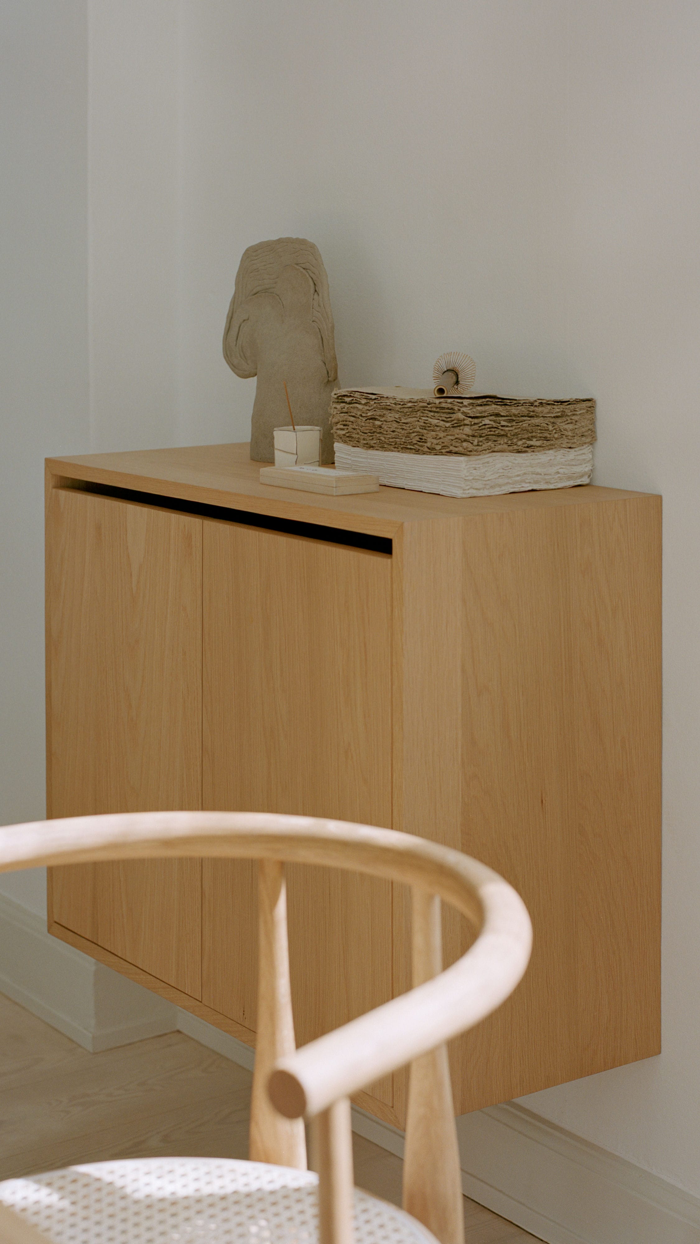 Hanging cabinet with the door of New Works Biały