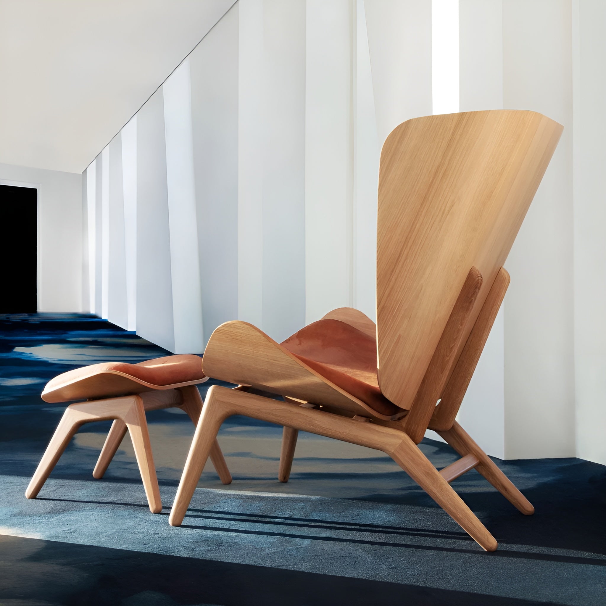 READER armchair in cognac leather with oak base
