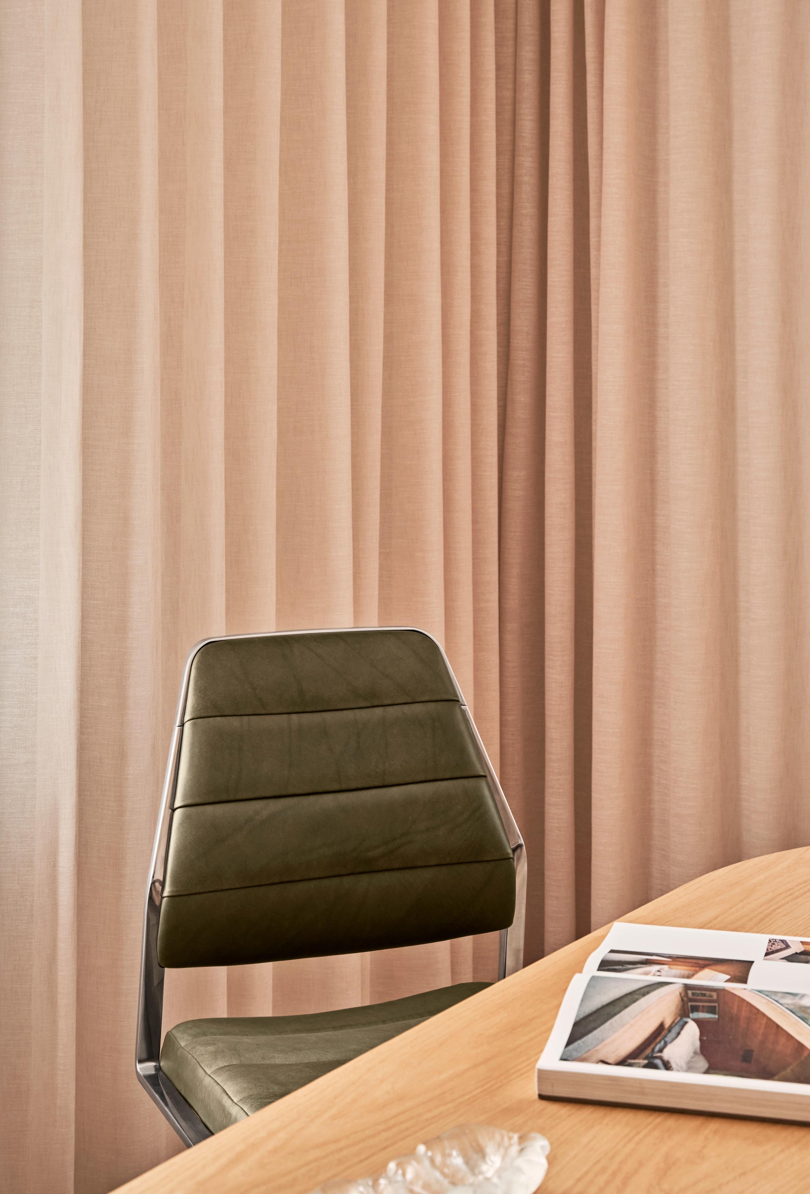 Office chair 454 in caramel leather with a metal base.