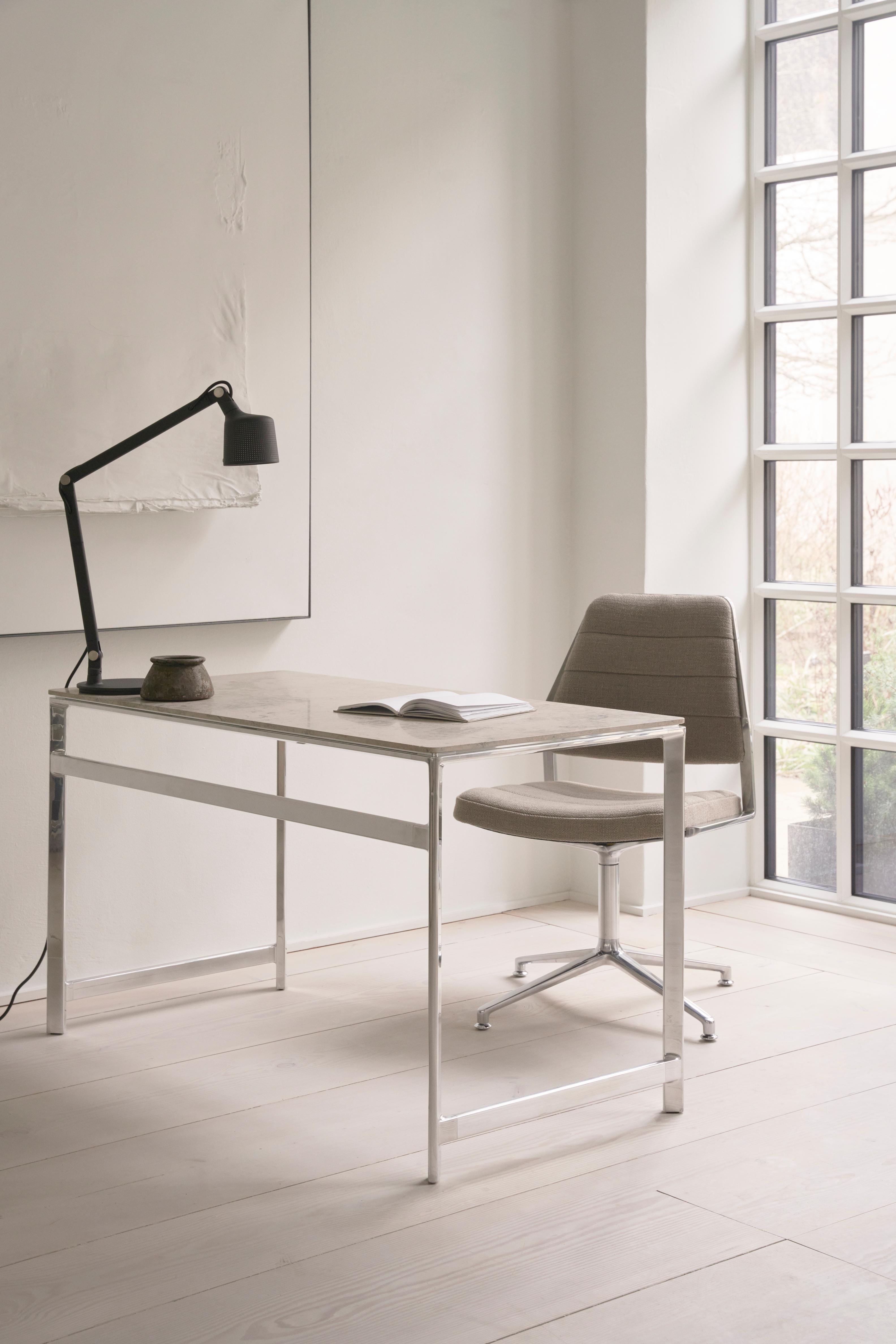 Office chair 454 in caramel leather with a metal base.