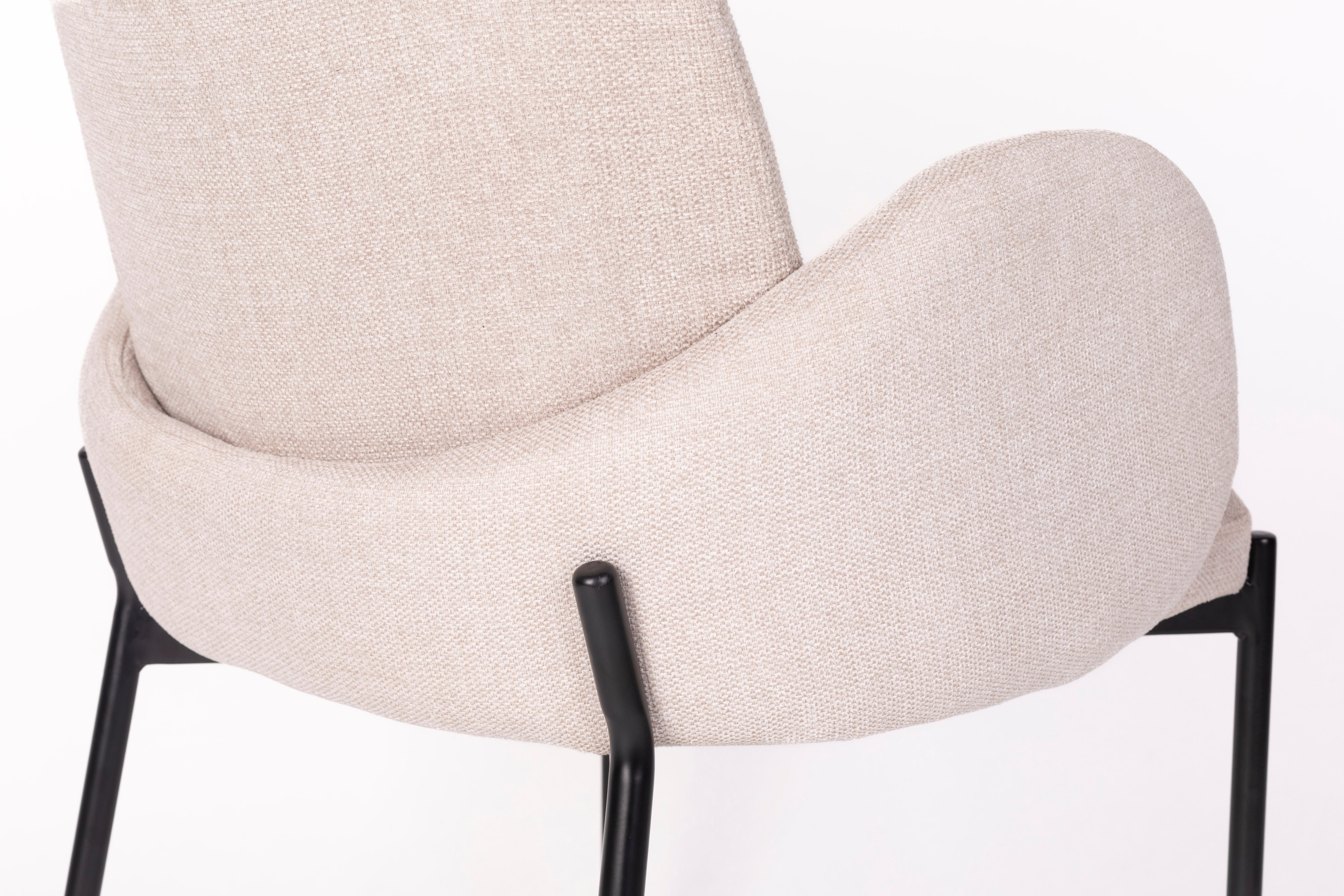 Chair with armrests, i.e. a creamy