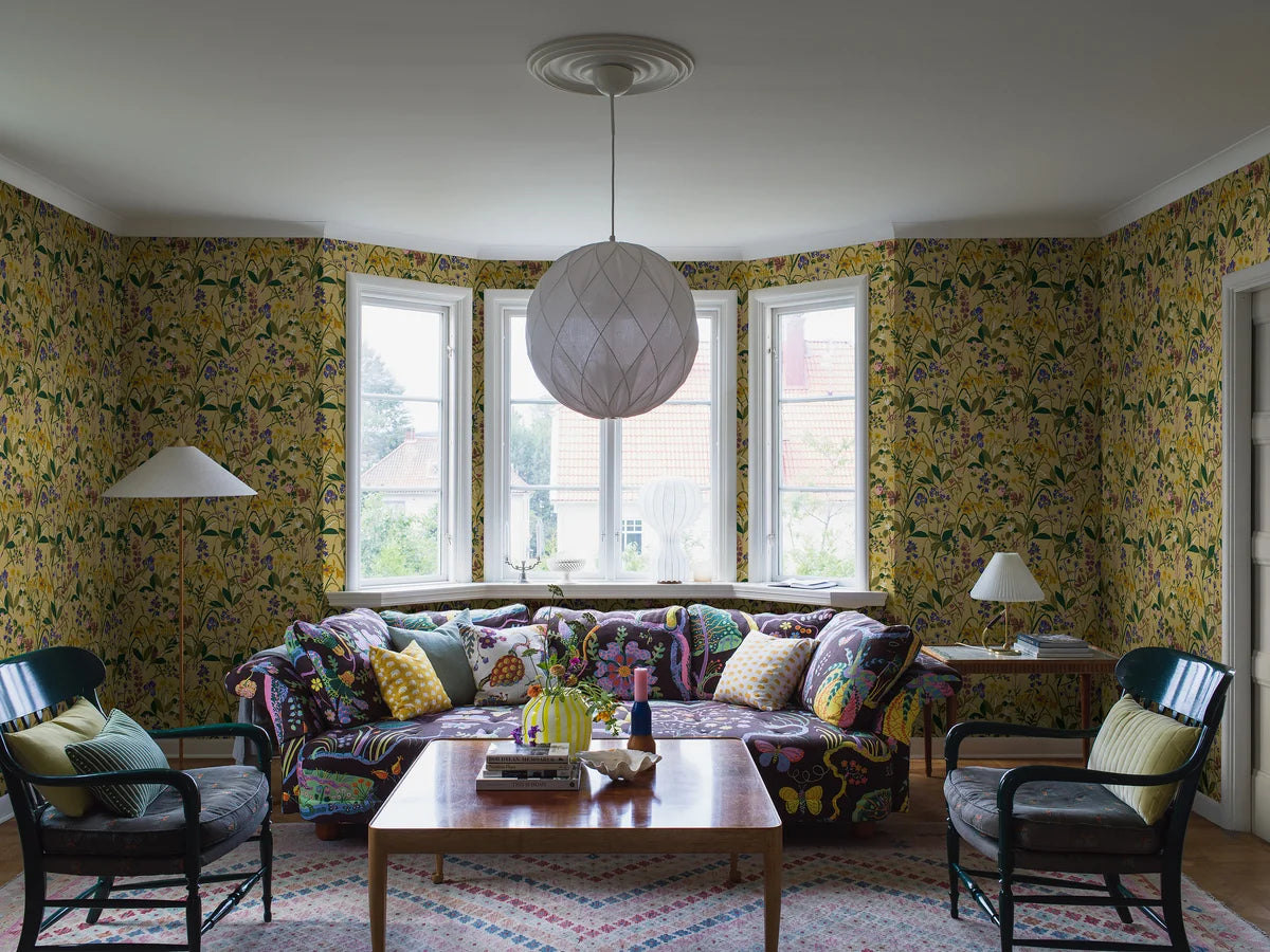 Wallpaper with a floral plant motif ROS OCH LILJA yellow