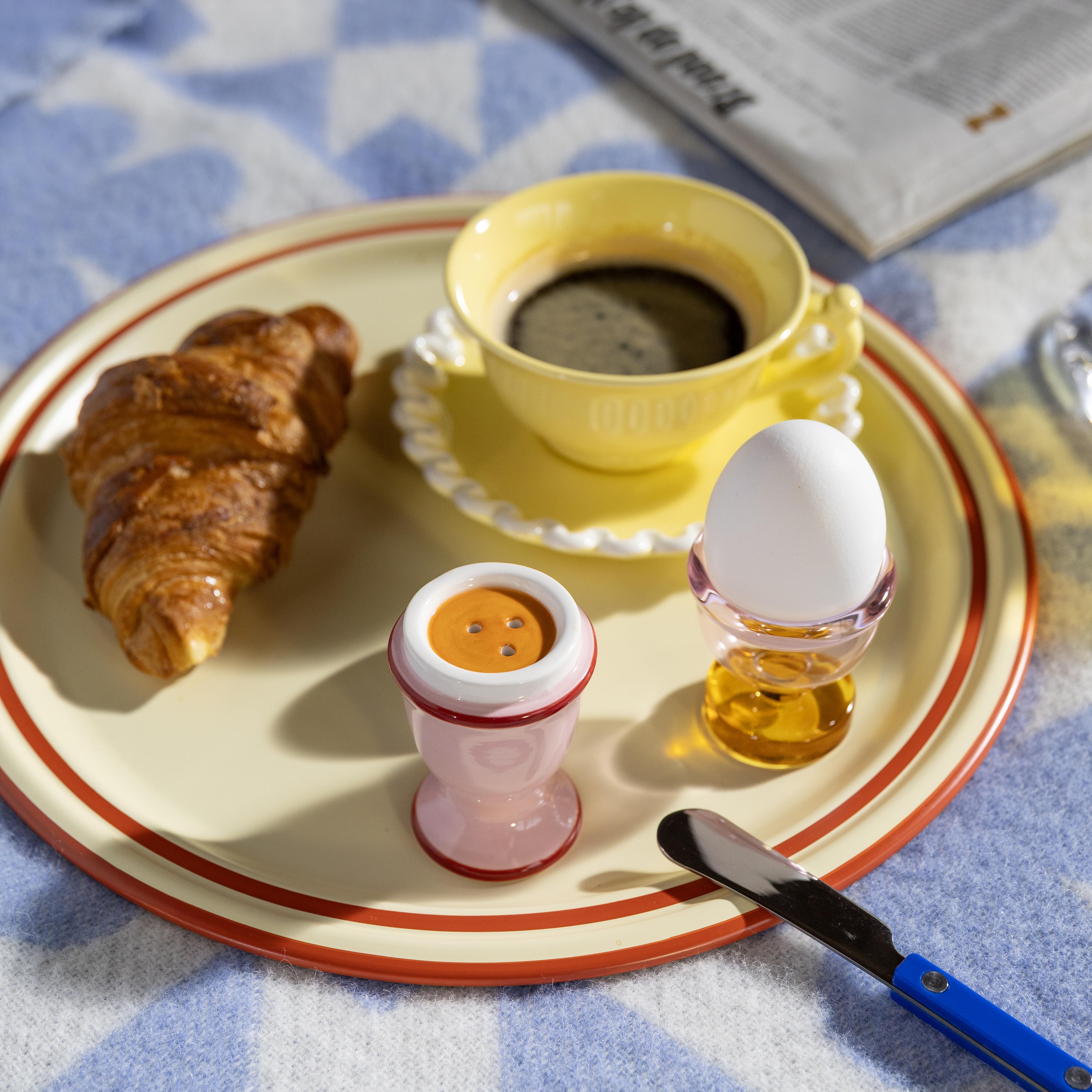 Egg-shaped salt and pepper shakers in pink with red and white