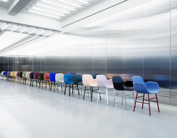 Chair with armrests brown forms with a chrome base