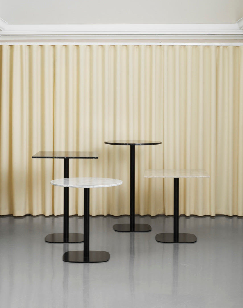 Round cafe table forms wooden top with a black base