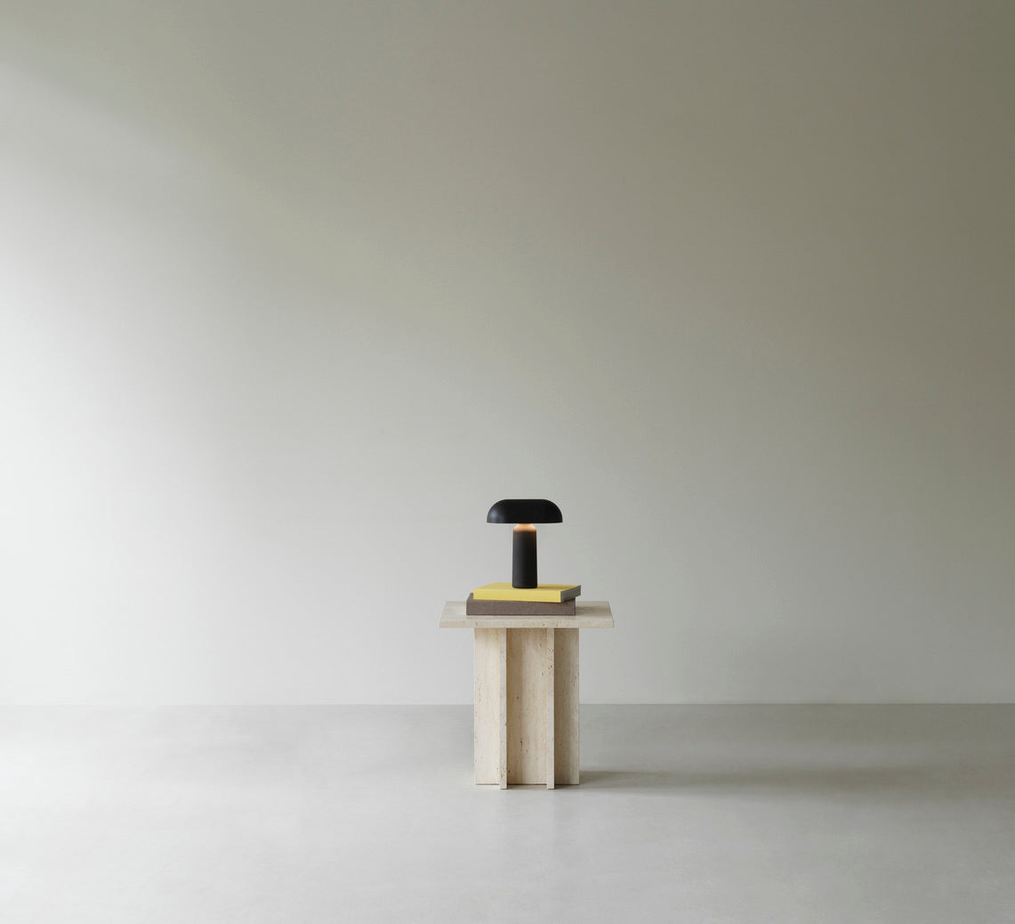 Edge travertine side table