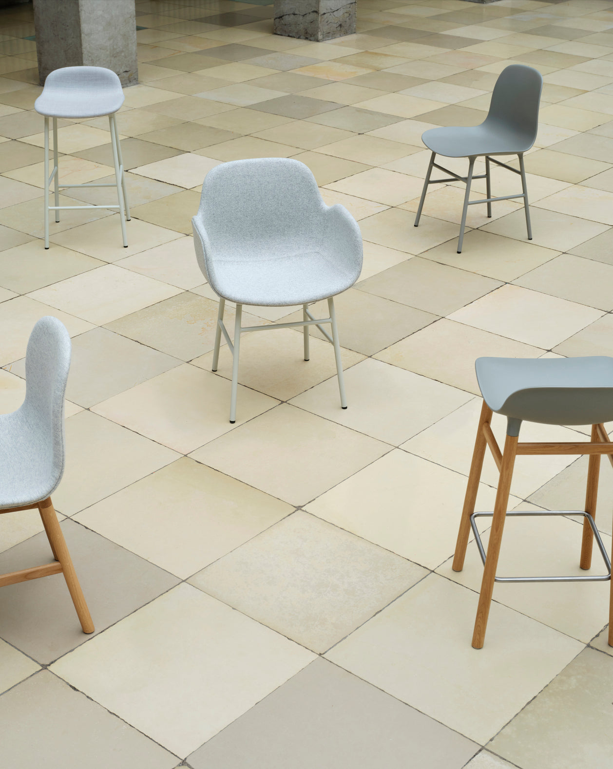 Hocker forms warm gray with an oak base