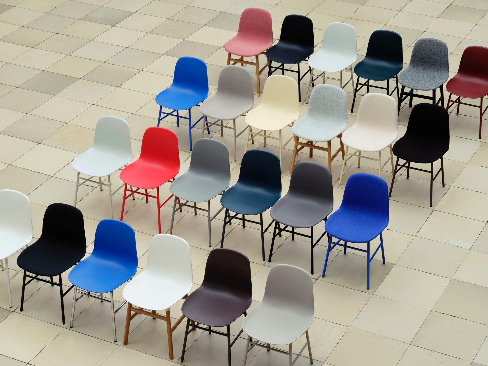 Upholstered chair forms with a blue base