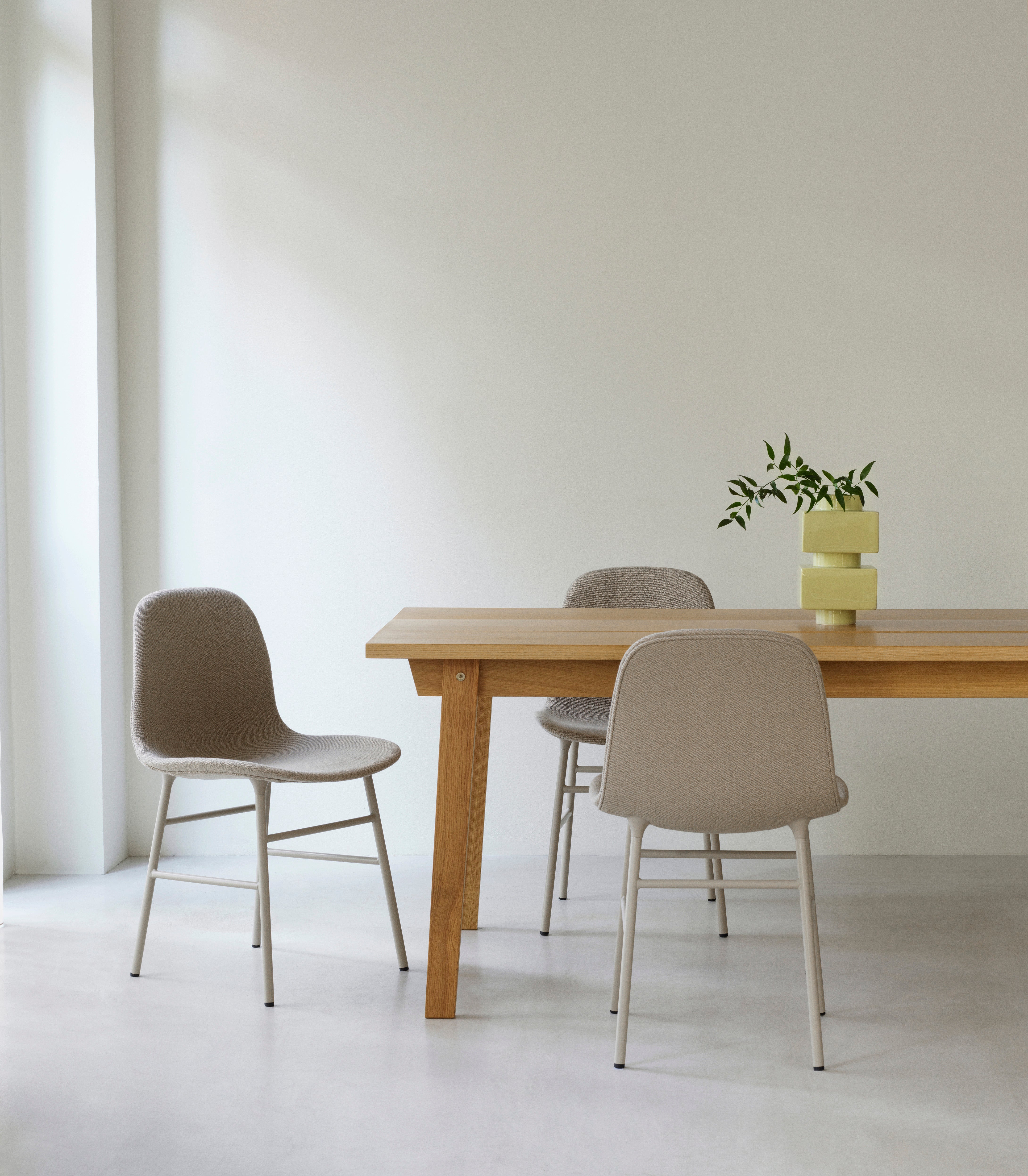 Upholstered chair forms with a light gray base