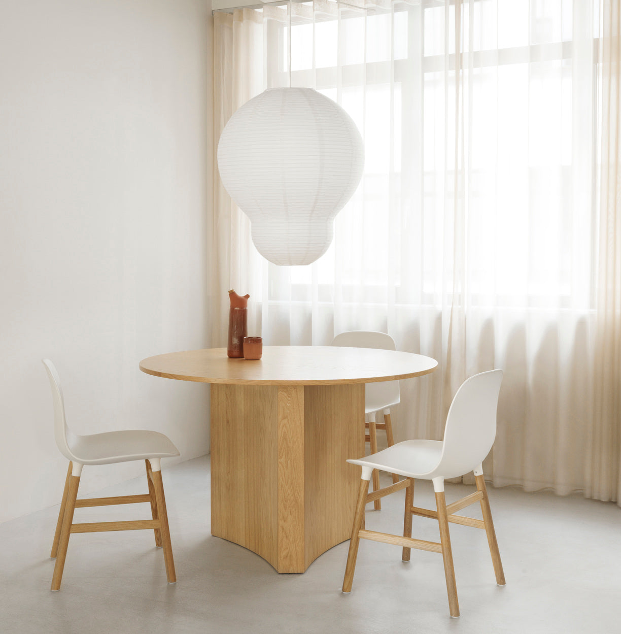 Chair of Form White with an oak base