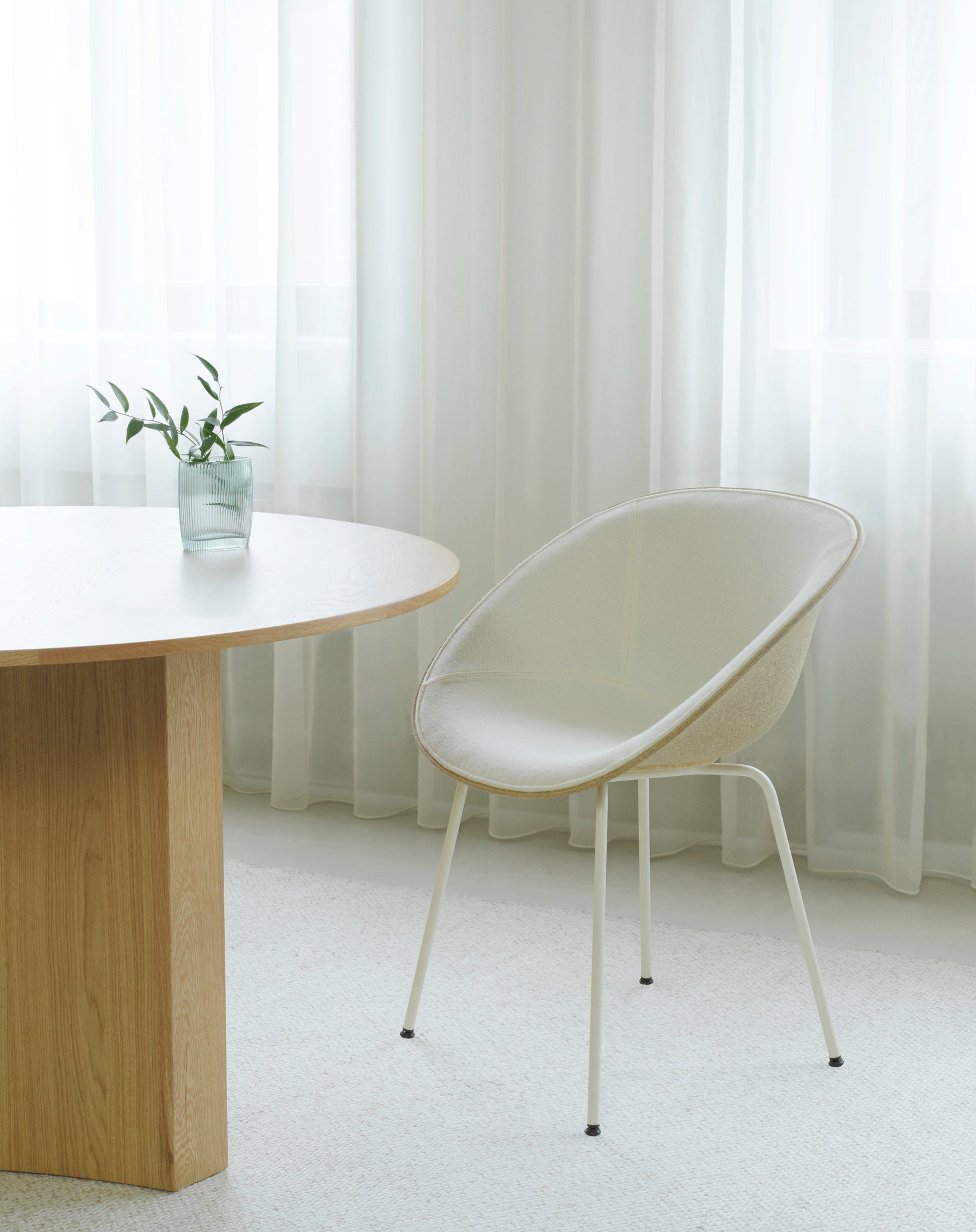 A chair upholstered mats with a black base