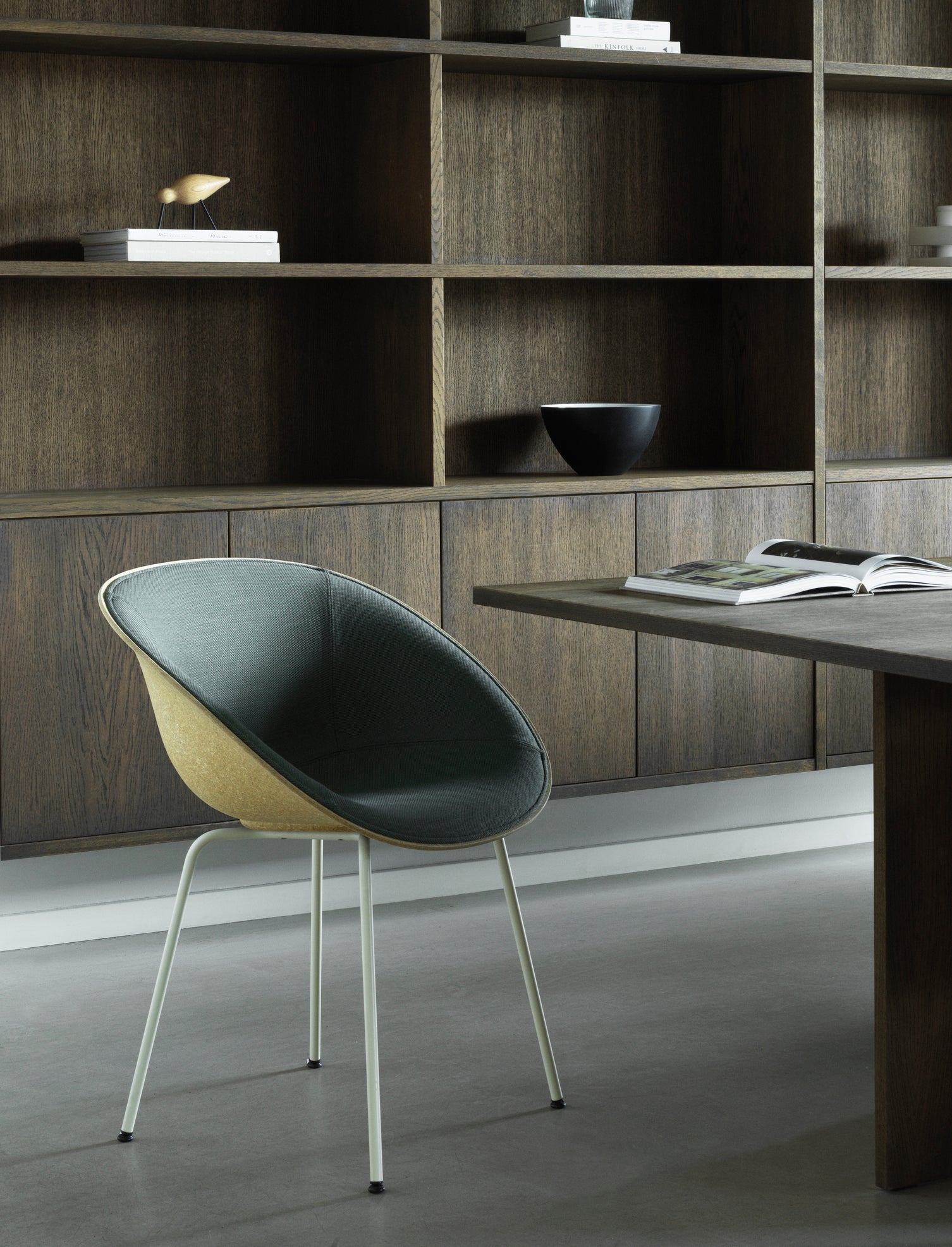 A chair upholstered mats with a black base