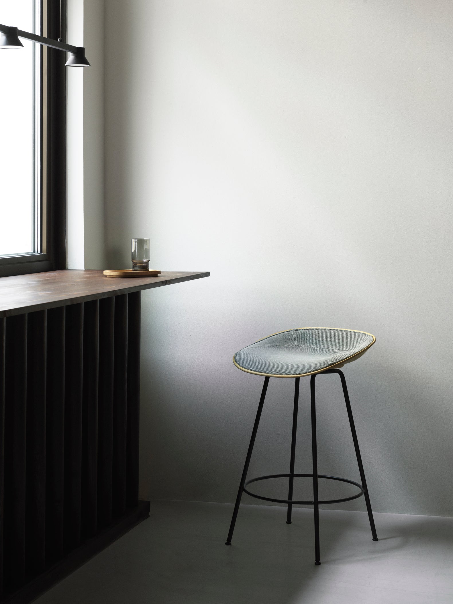 Upholstered green rods with a black base