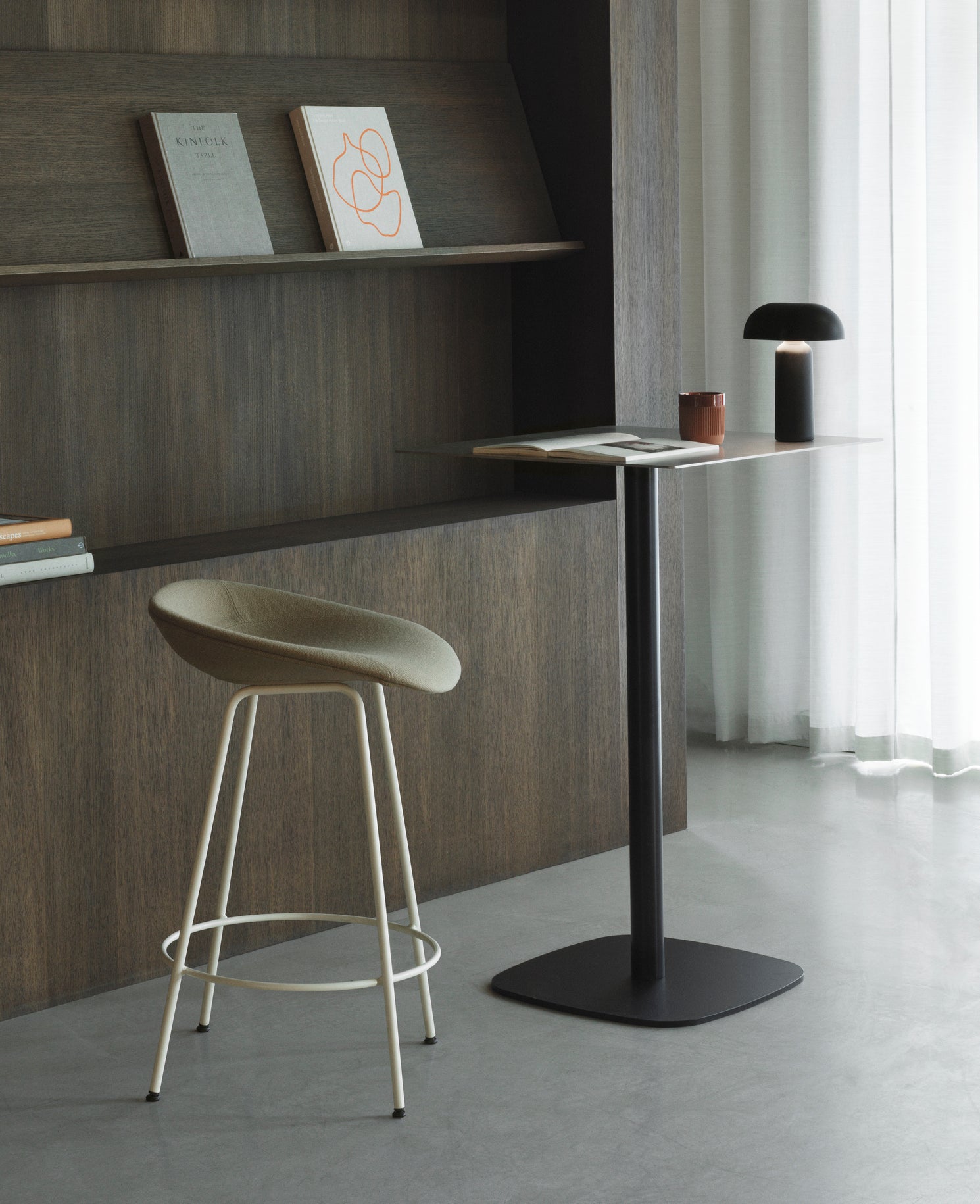 Upholstered green rods with a black base