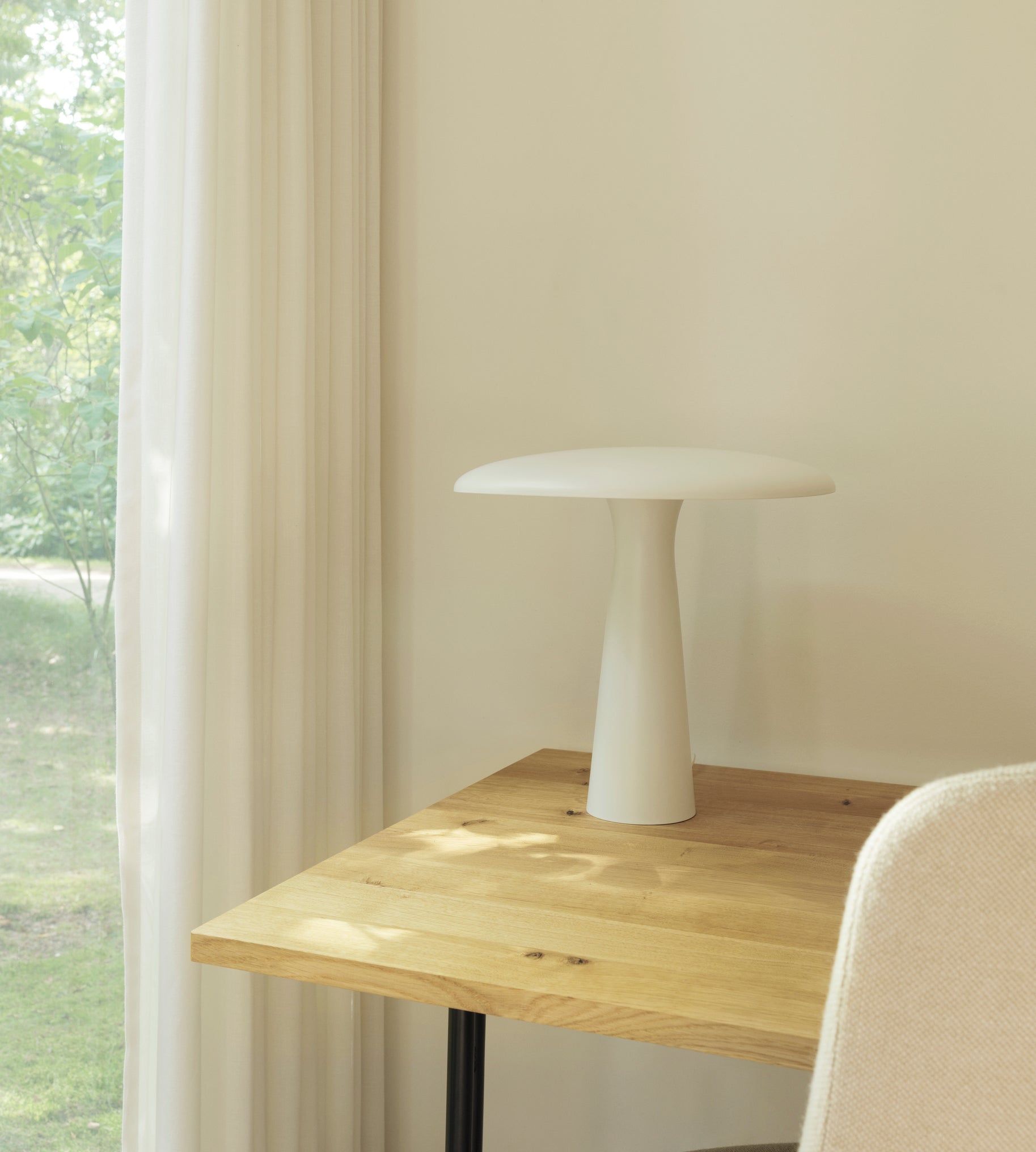 Kip desk, a natural pine with a black base