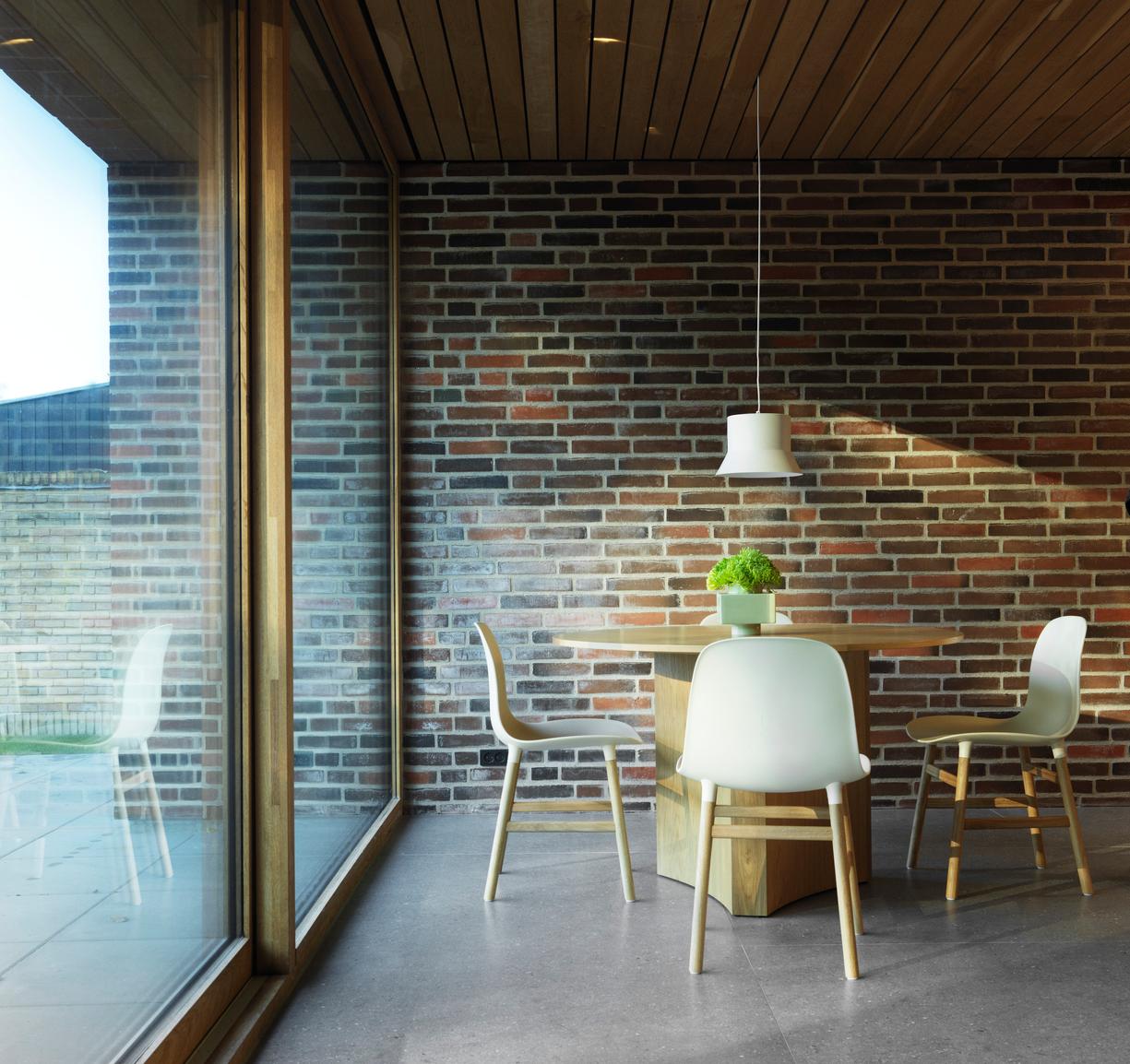 Black forms chair with a nutty base