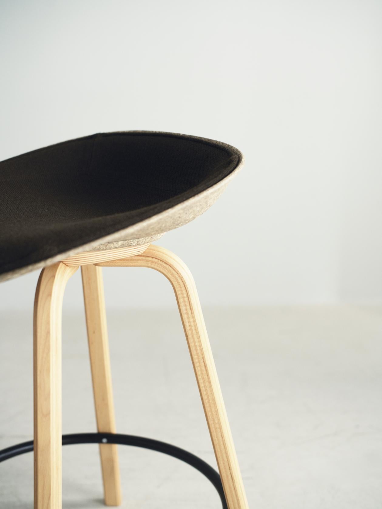 Upholstered beige matrix chair with a beech base