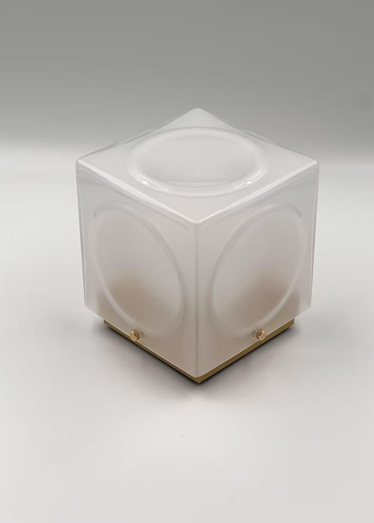 CHANT portable lamp with a matte shade and a gold base.