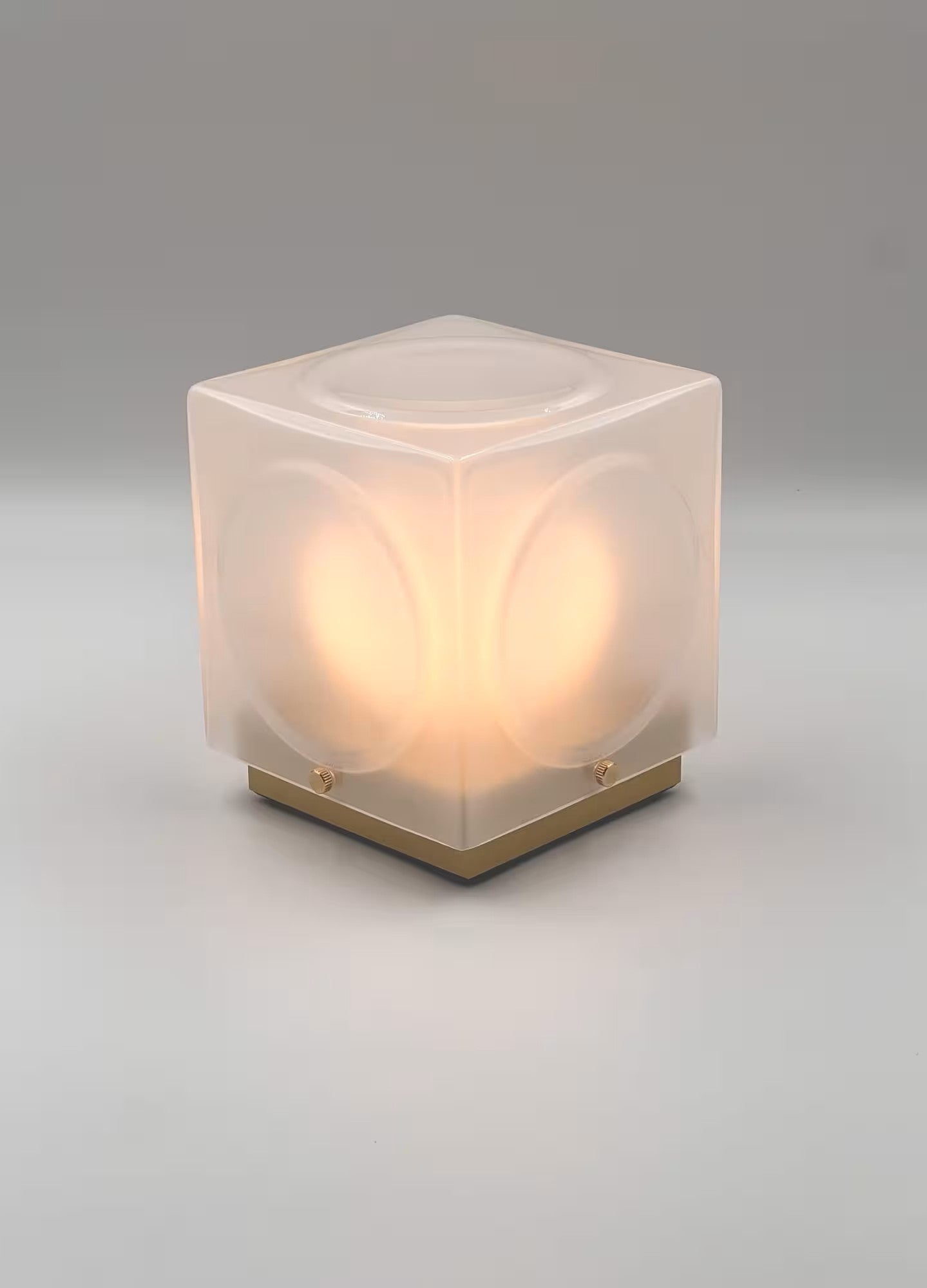 CHANT portable lamp with a matte shade and a gold base.