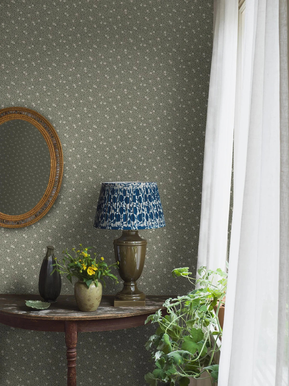 Wallpaper with a floral pattern of flowers and leaves MYRTEN green with white