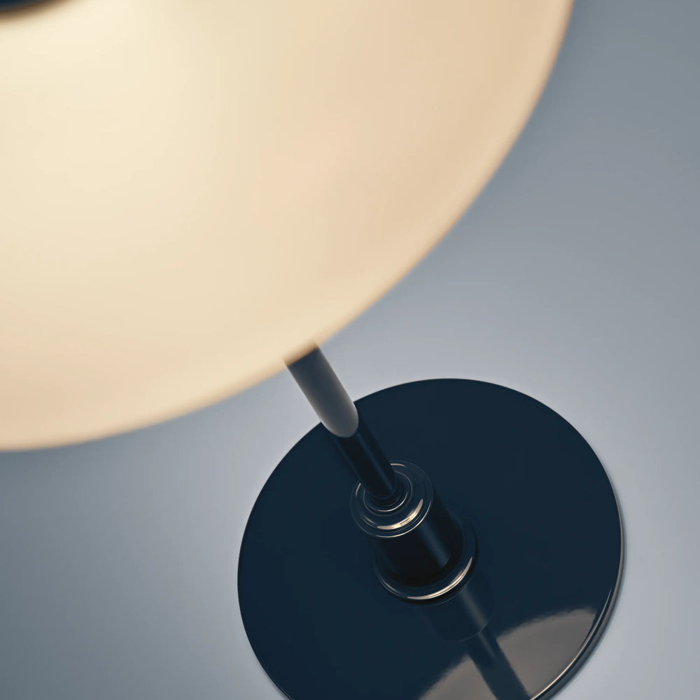 PH 2/1 table lamp in white with a navy blue base