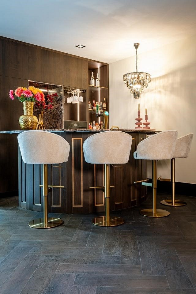 Bar chair is beige with a golden base