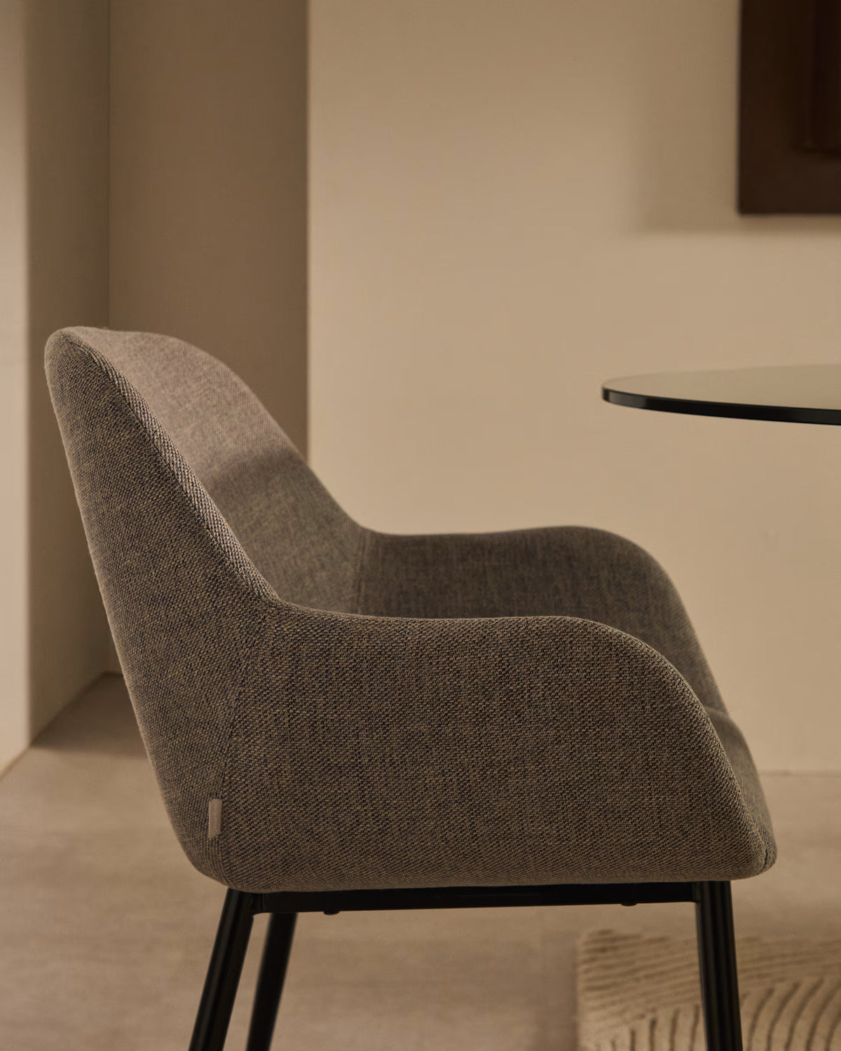 A chair in the bright -gray horse fabric with a black base