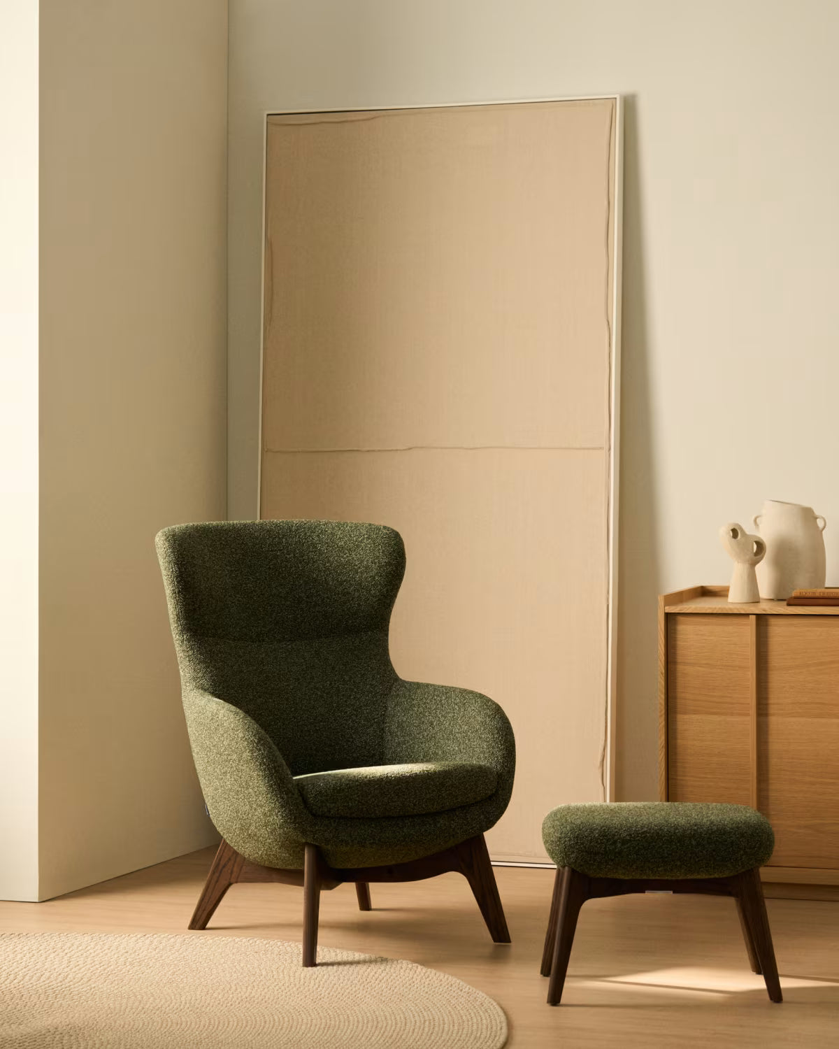 ADIRAN footstool in green chenille with a dark oak base.
