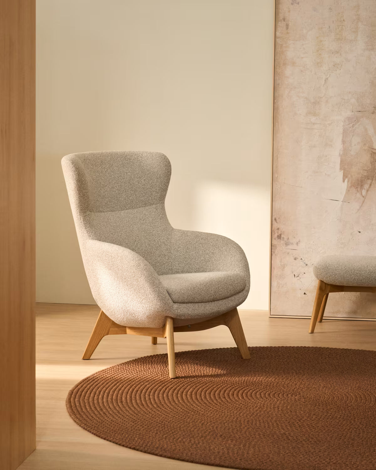 ADIRAN armchair in light beige chenille with a dark oak base.