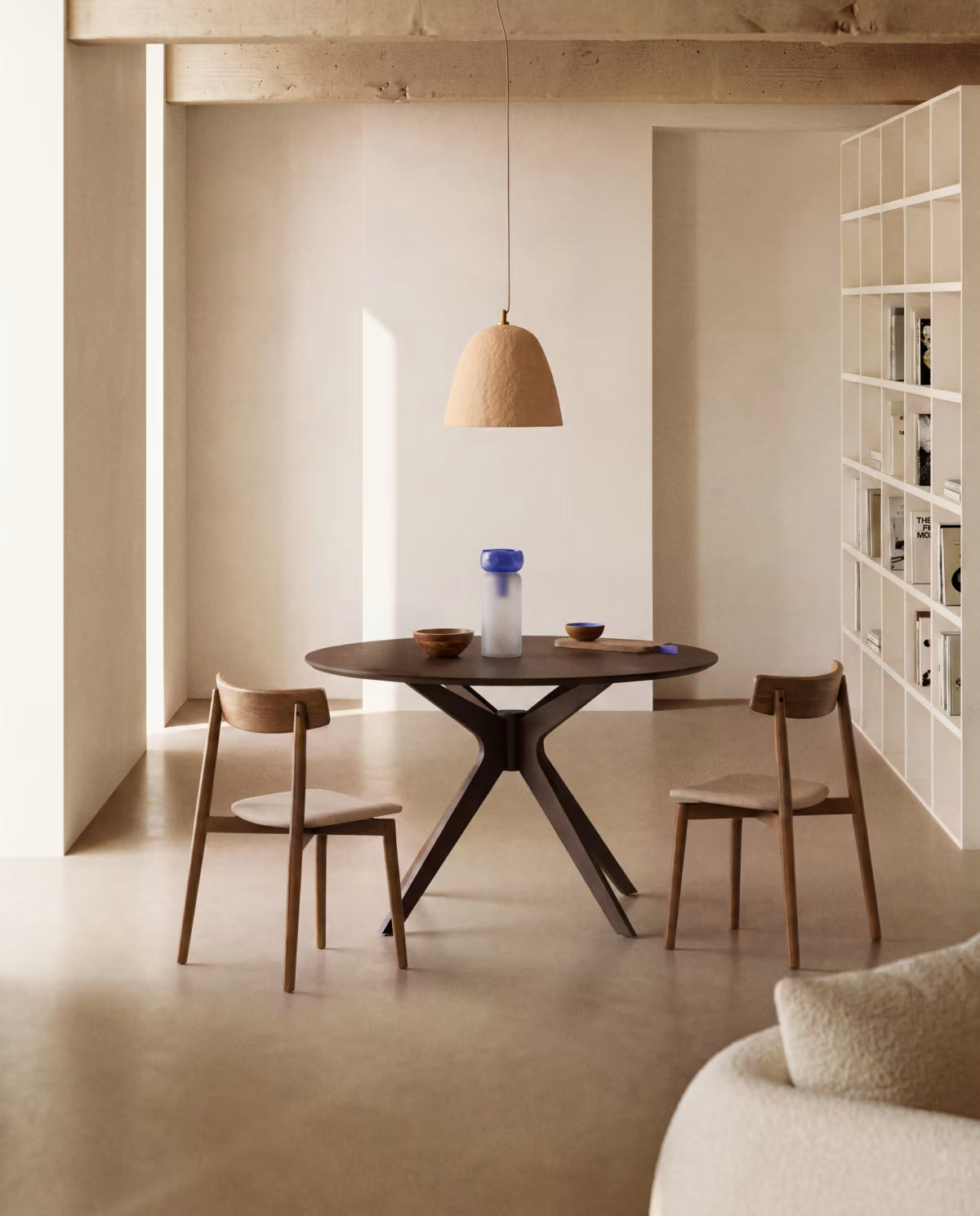 EVERA chair in beige chenille with a dark oak veneered base.