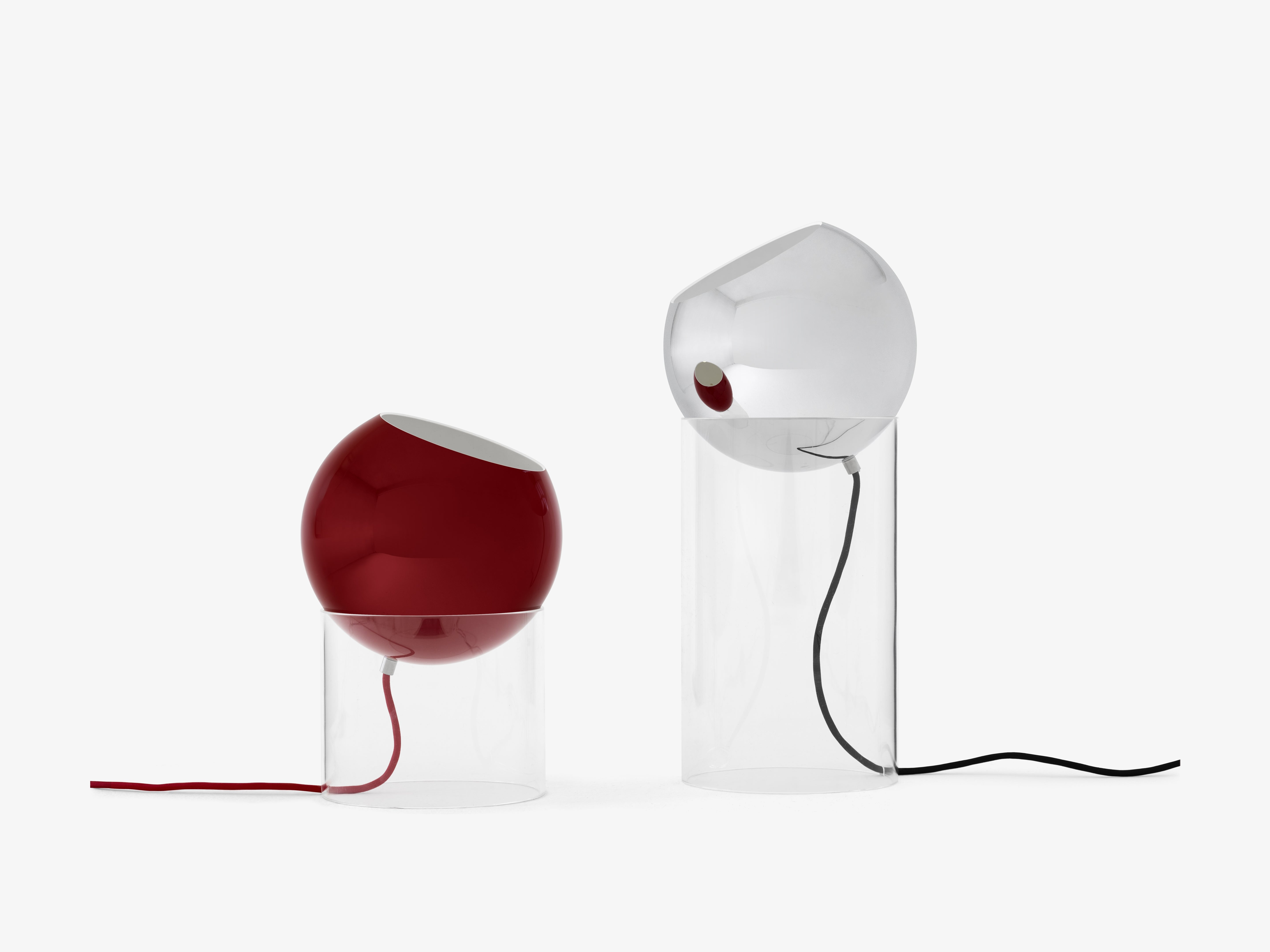 TOPAN table lamp with a red shade and transparent base.
