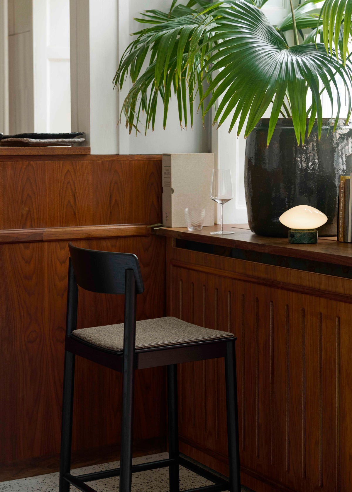 BETTY stool in black lacquered ash with an upholstered seat