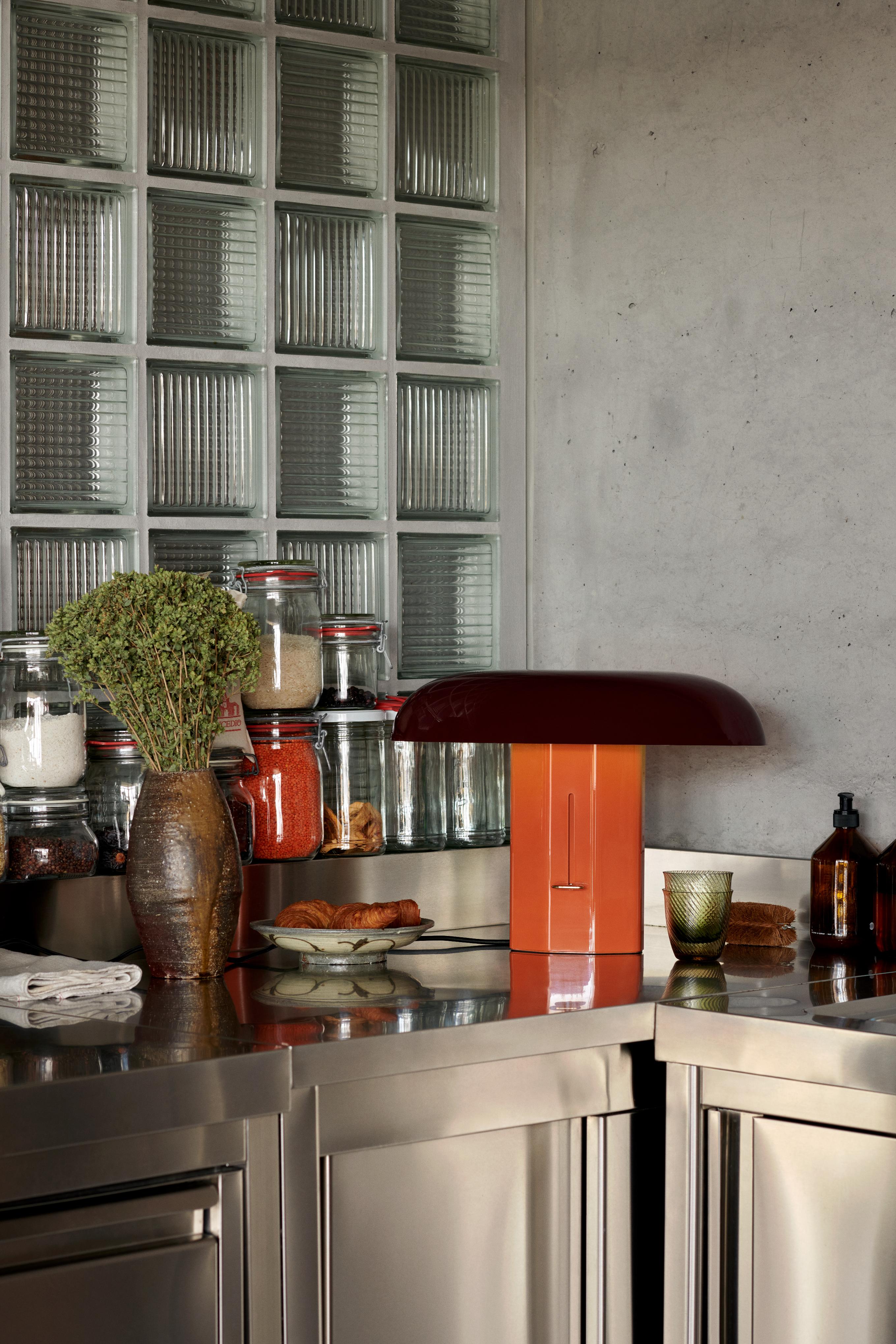 MONTERA JH42 table lamp with a ruby shade and amber base.
