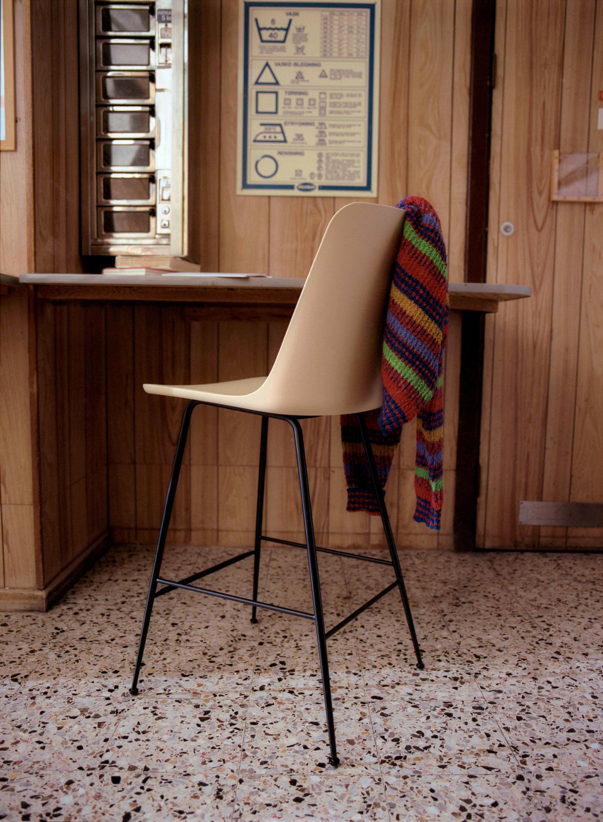 RELY bar stool in white with a brown steel base