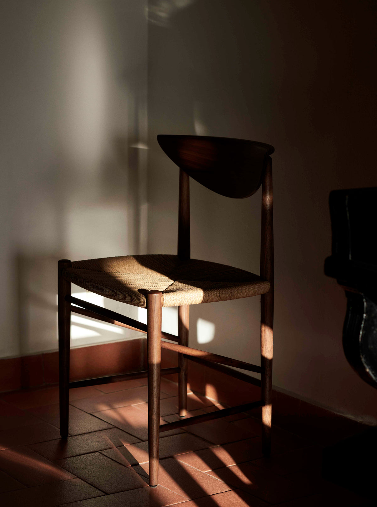 DRAWN HM3 chair in oiled walnut with a woven seat