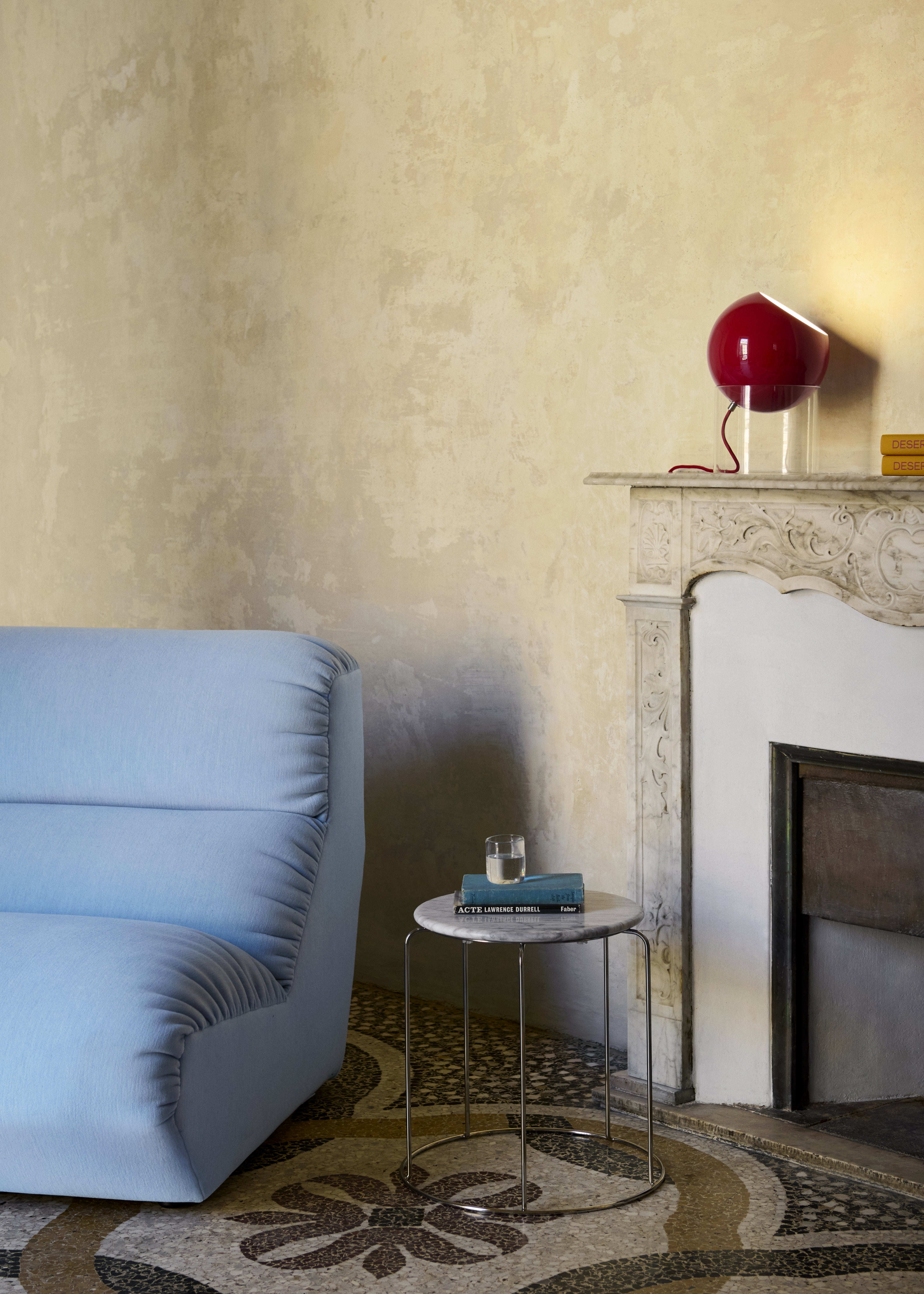 TOPAN table lamp with a red shade and transparent base.
