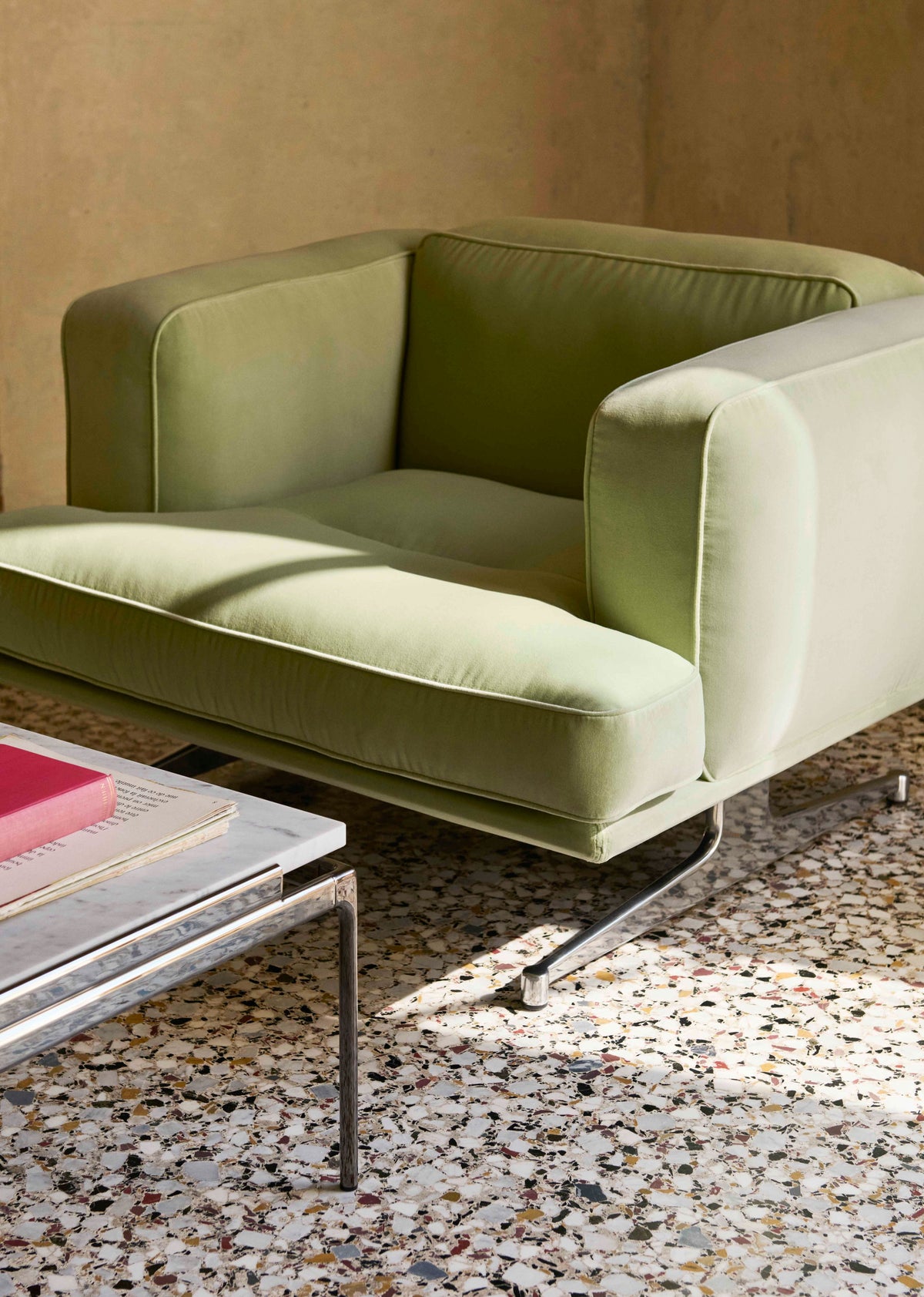 INLAND AV21 upholstered armchair with a black base