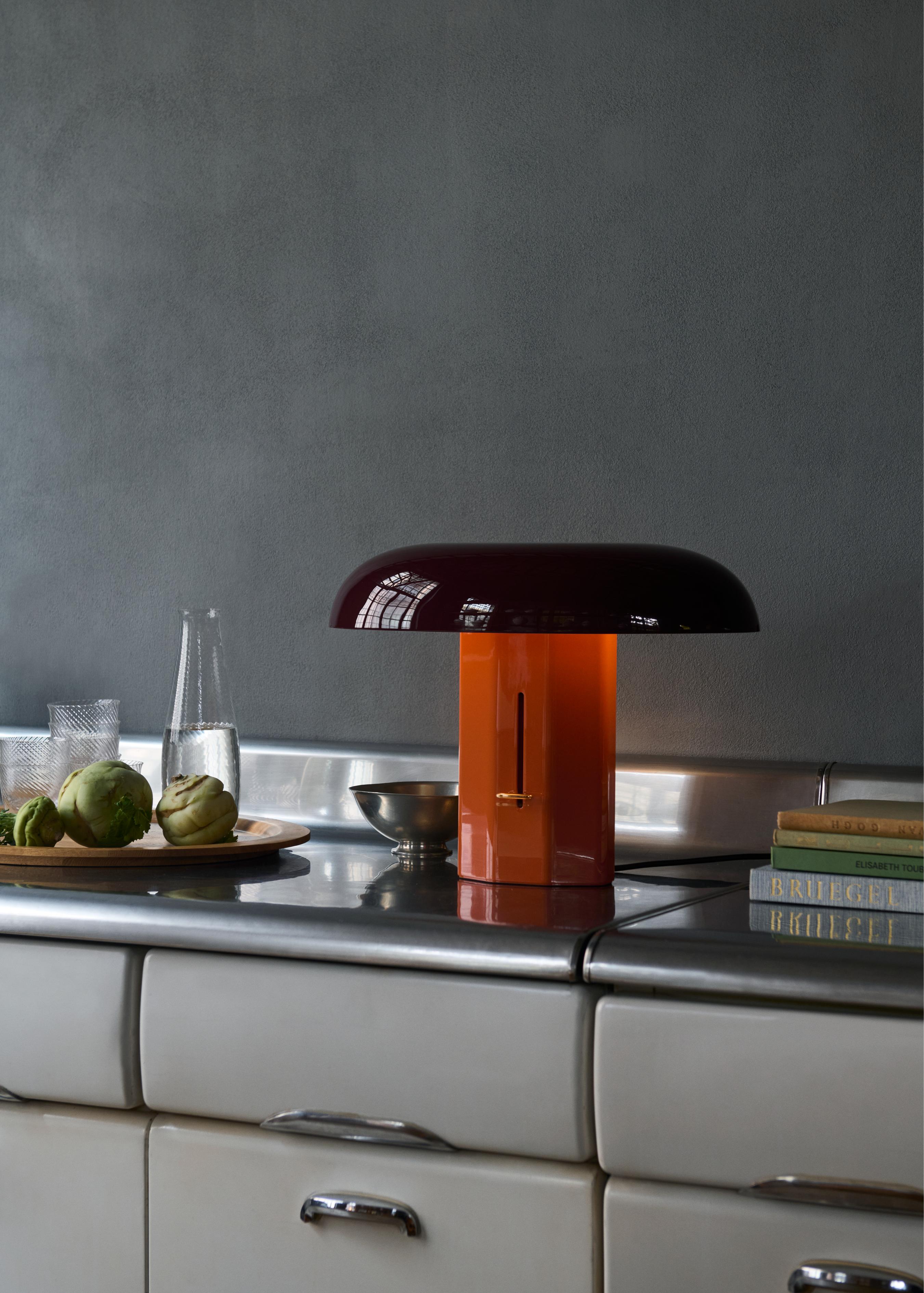MONTERA JH42 table lamp with a ruby shade and amber base.