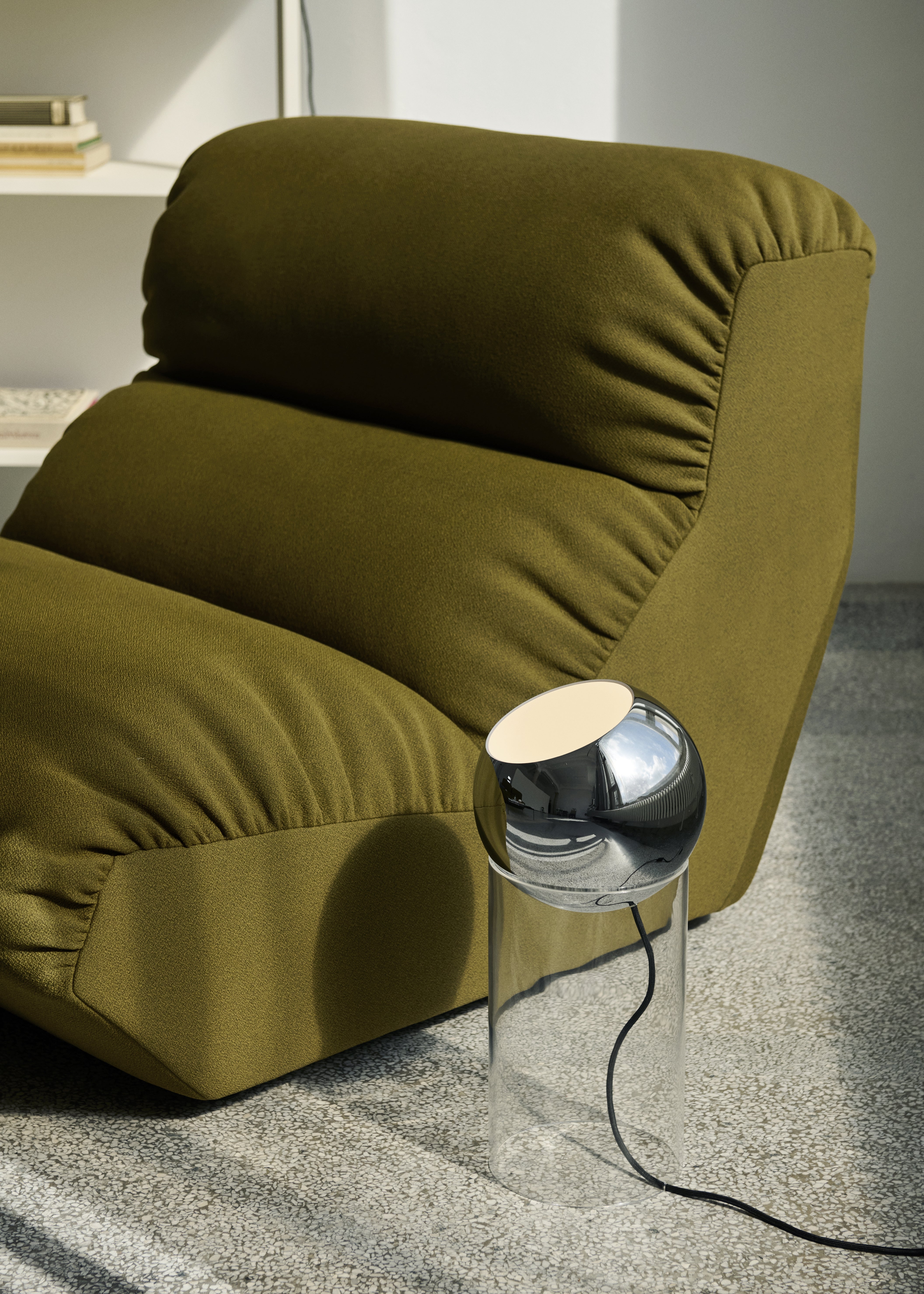 TOPAN table lamp with a chrome shade and transparent base.