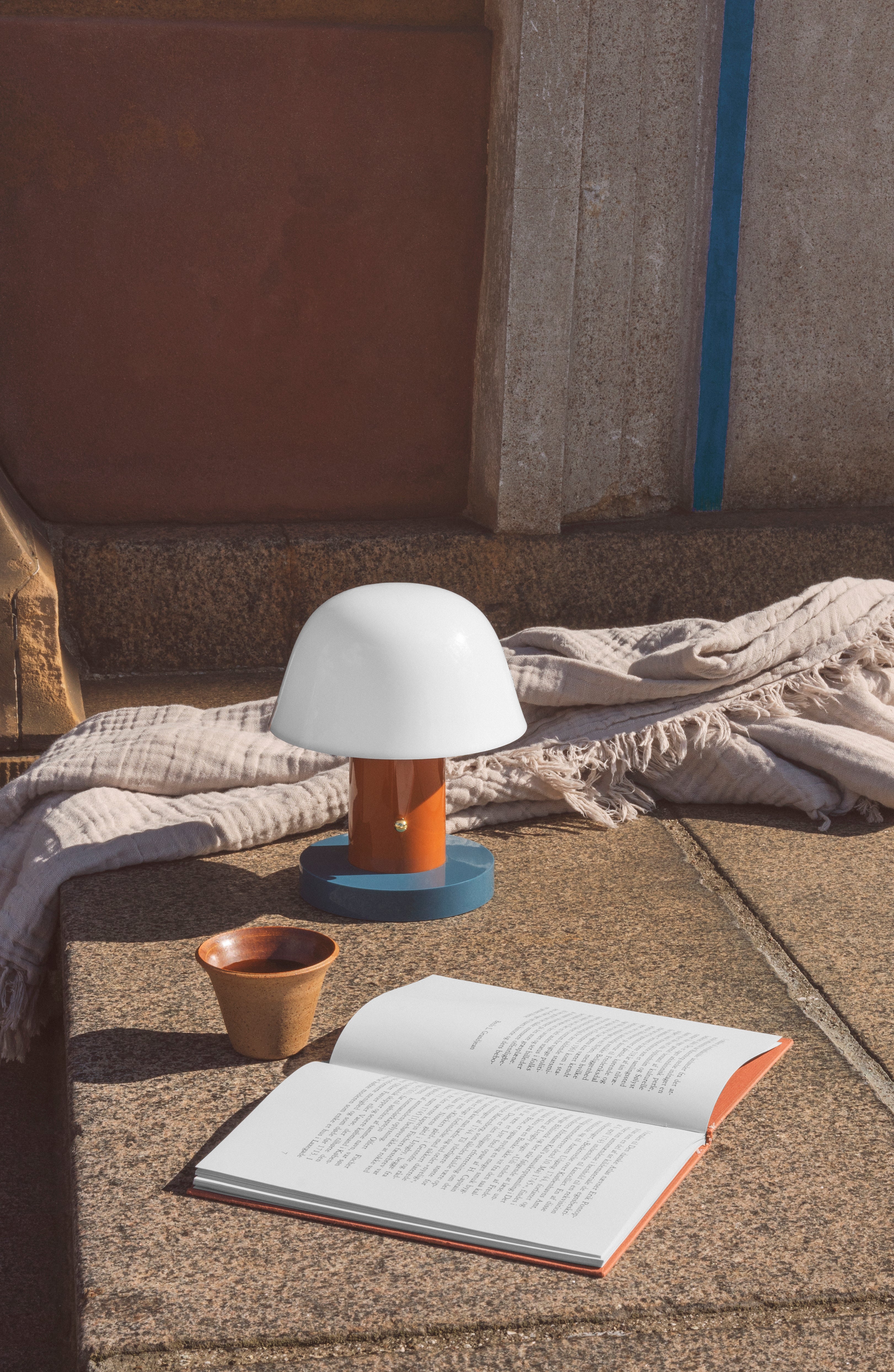 Portable lamp SETAGO JH27 with a cream shade and an orange-blue base.