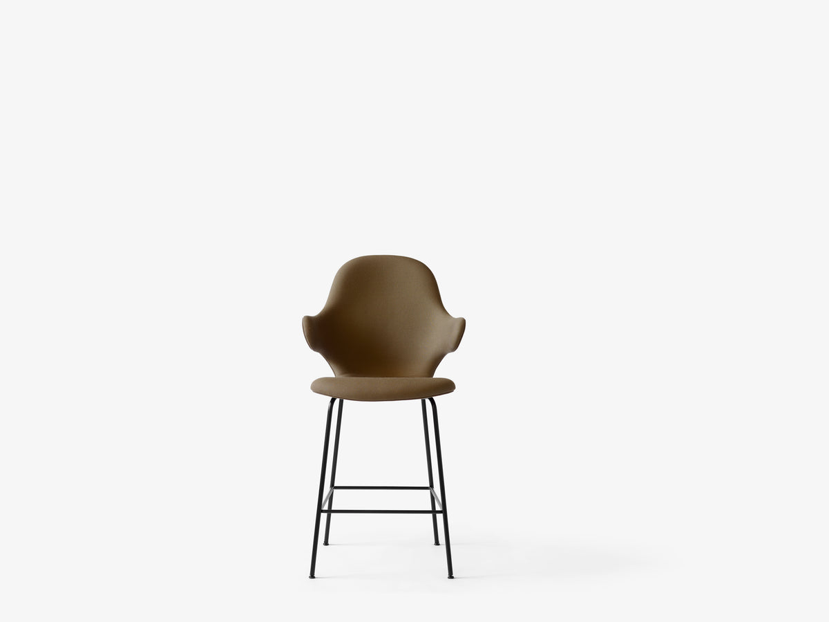 CATCH upholstered stool with a black base