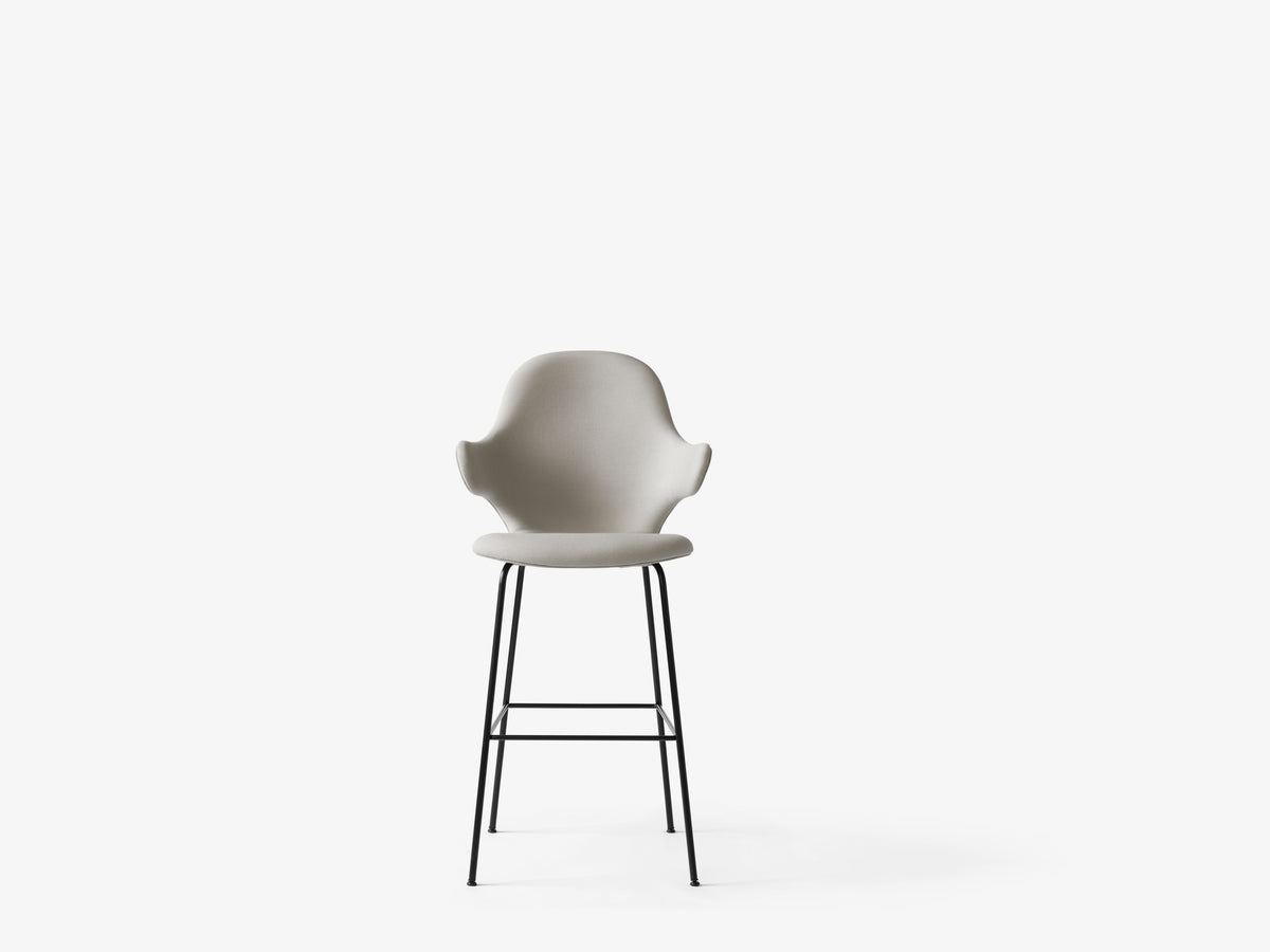 CATCH upholstered stool with a black base