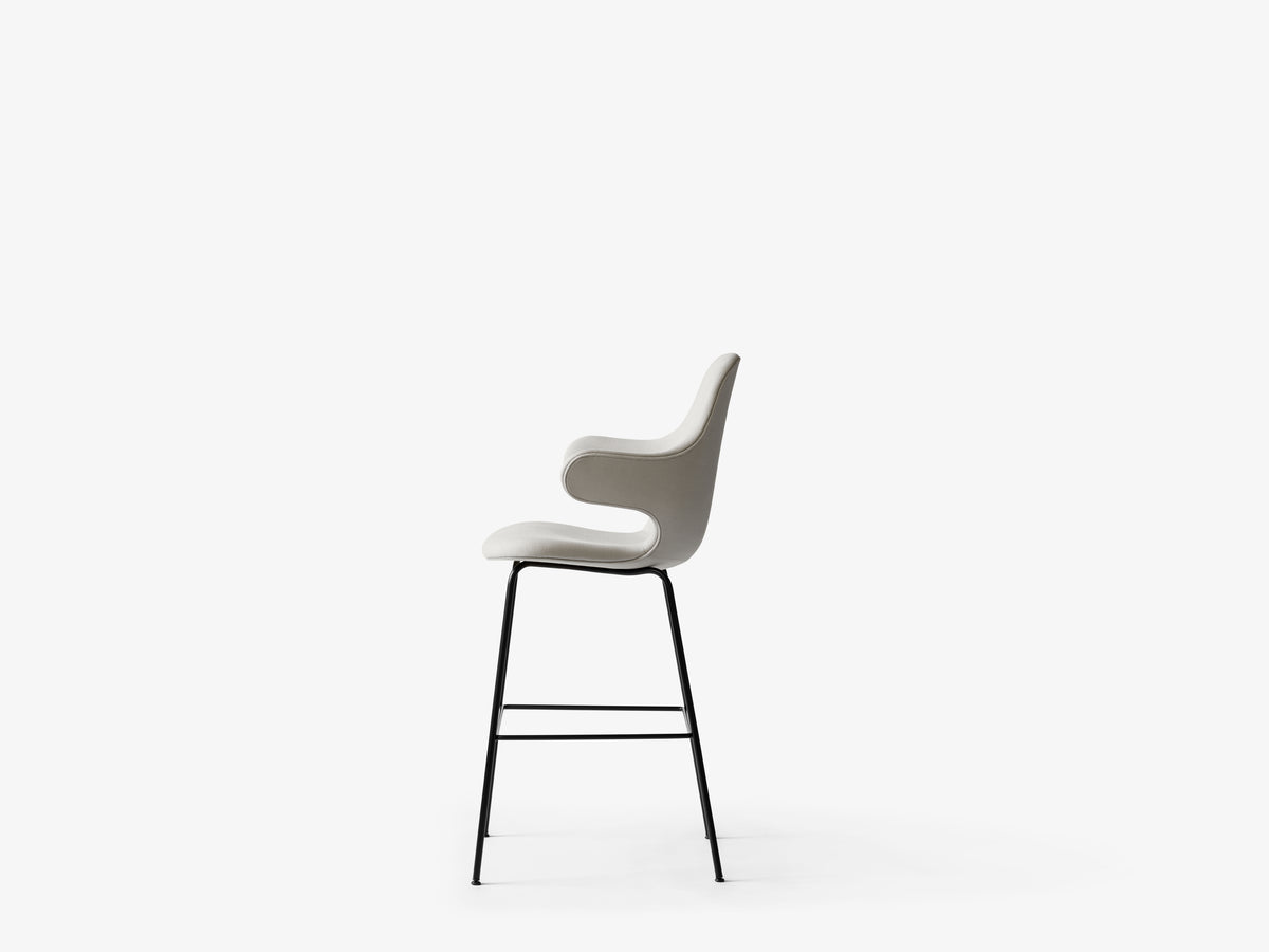 CATCH upholstered stool with a black base
